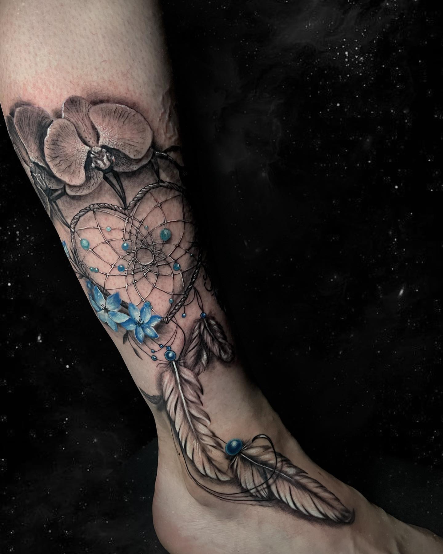 Dreamcatcher and flowers realism tattoo on the forearm by Ksu Storm, San Francisco, California