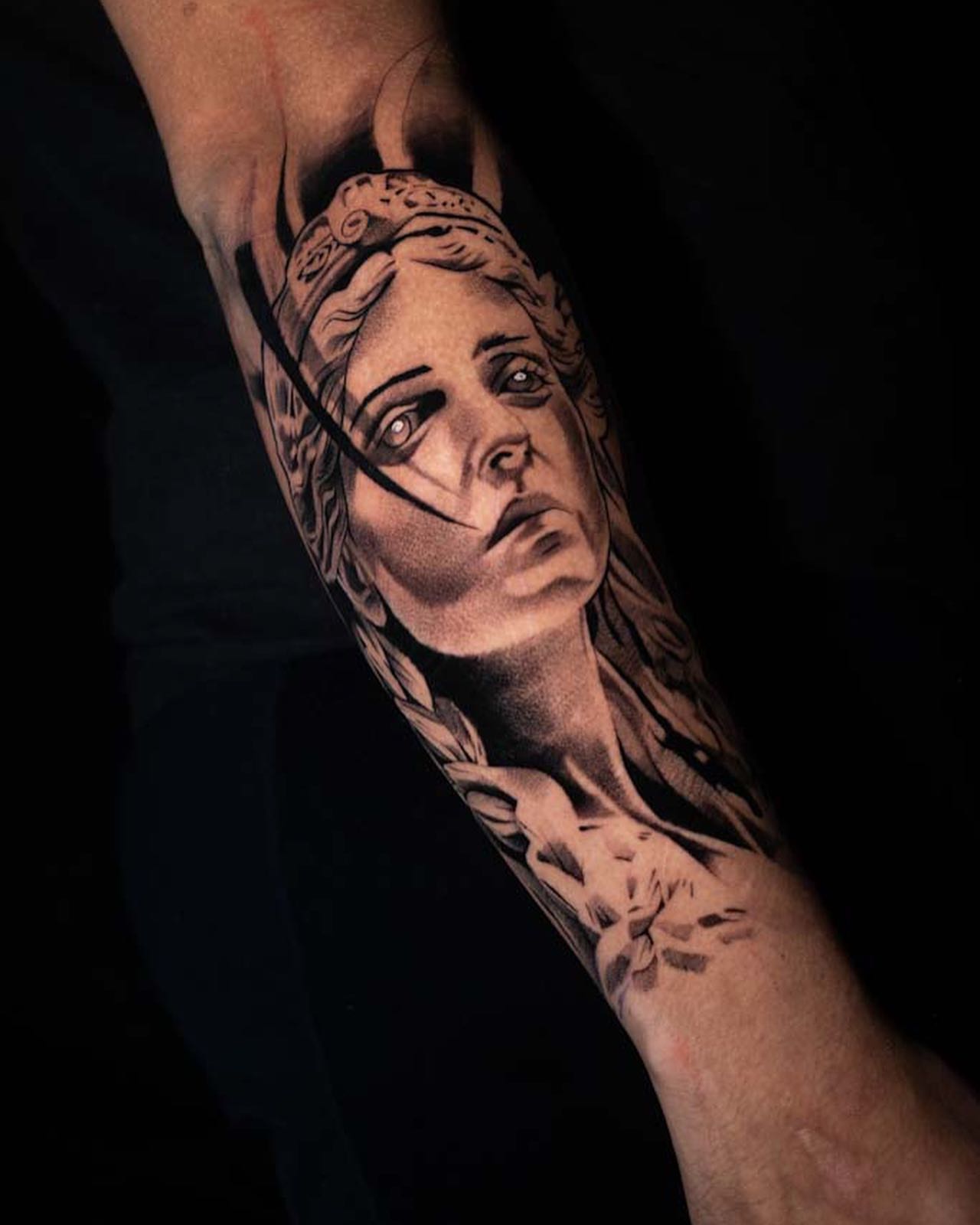Woman's face realism tattoo on the forearm by Javier Ramos