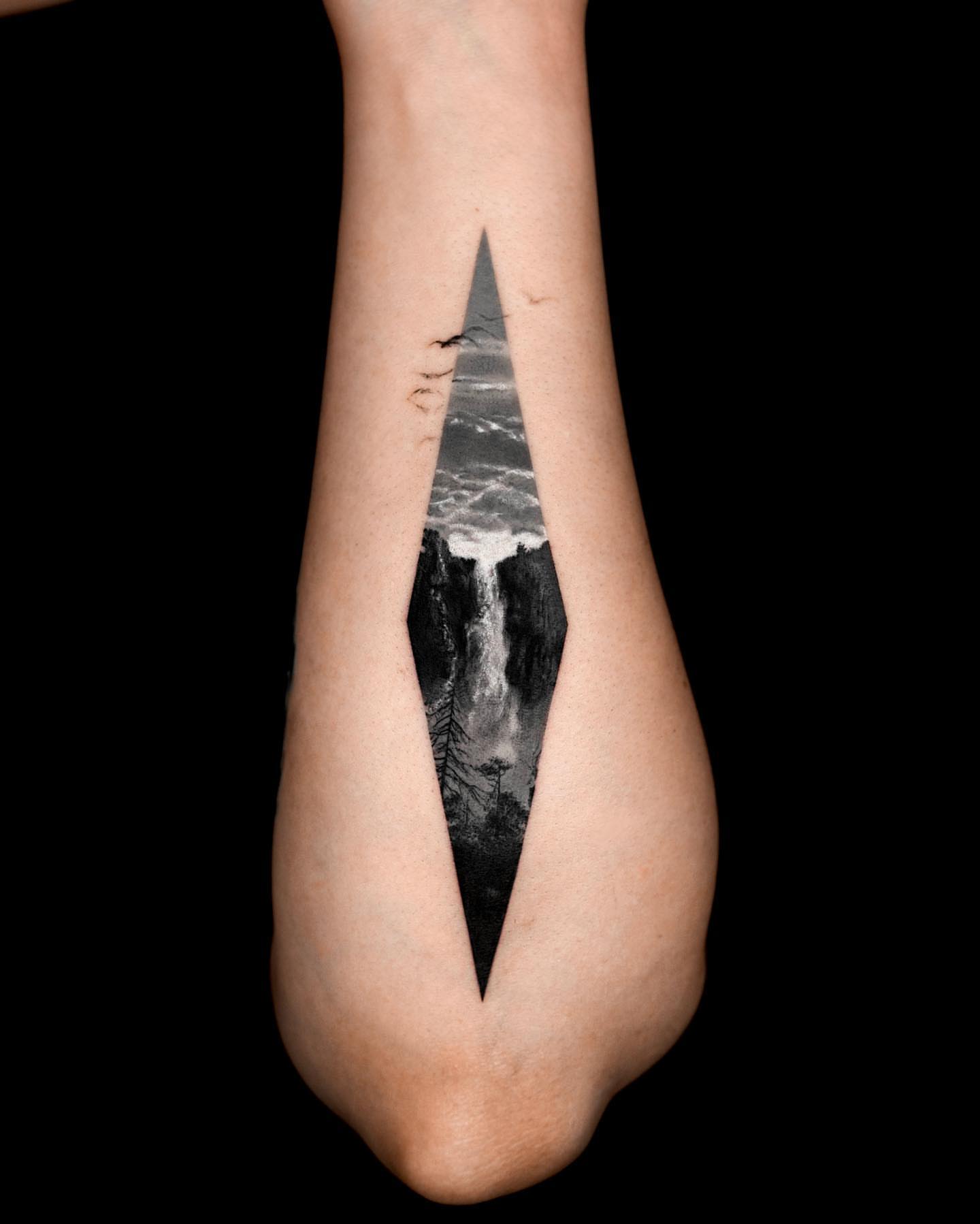 Waterfall realism tattoo on the forearm by Rizn
