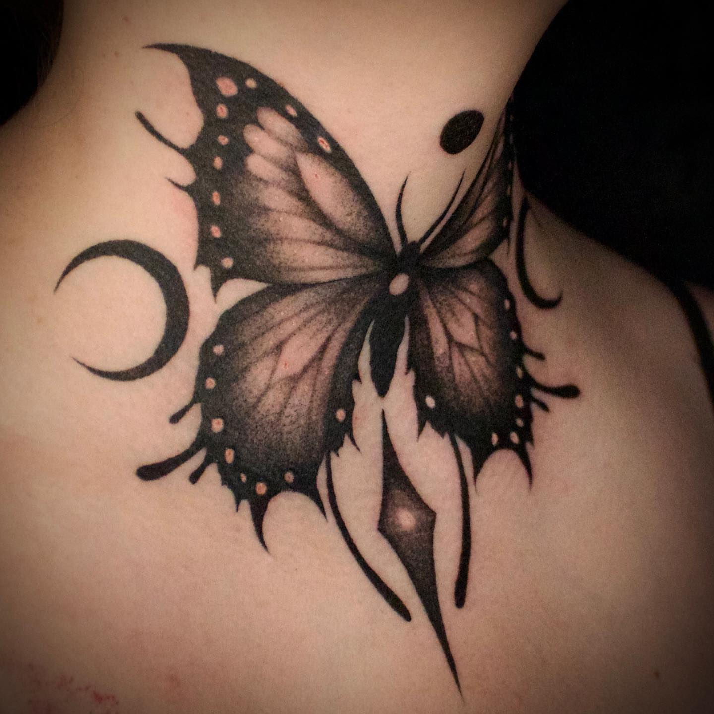 Butterfly realism tattoo on the back by Galen