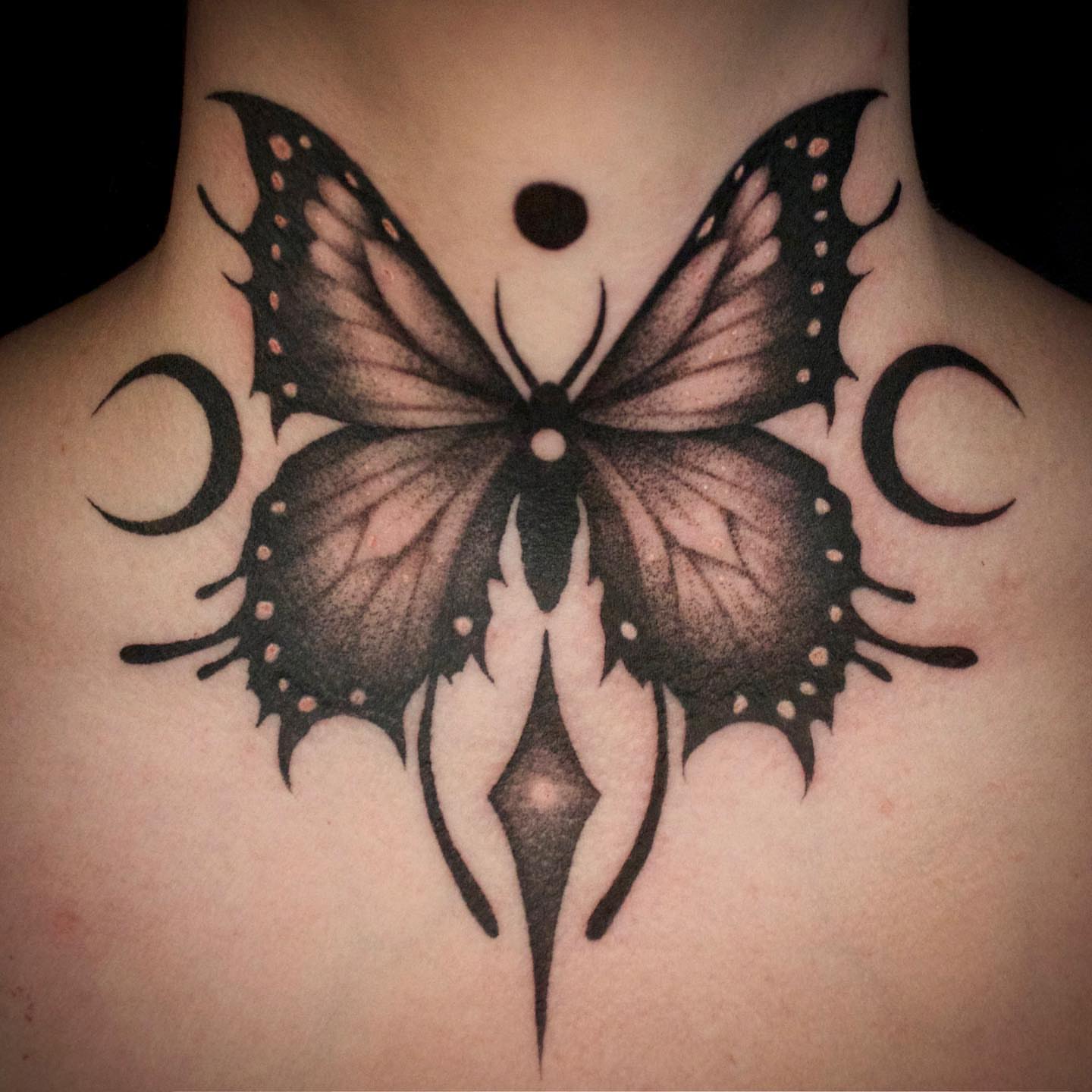Butterfly black and grey tattoo on the chest by Galen