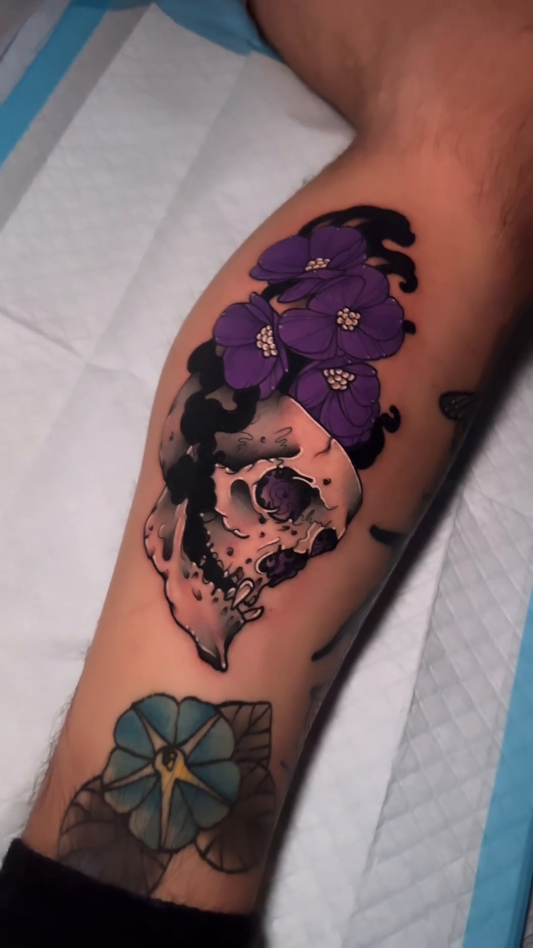 Skull with flowers dark realism tattoo by gillian marie