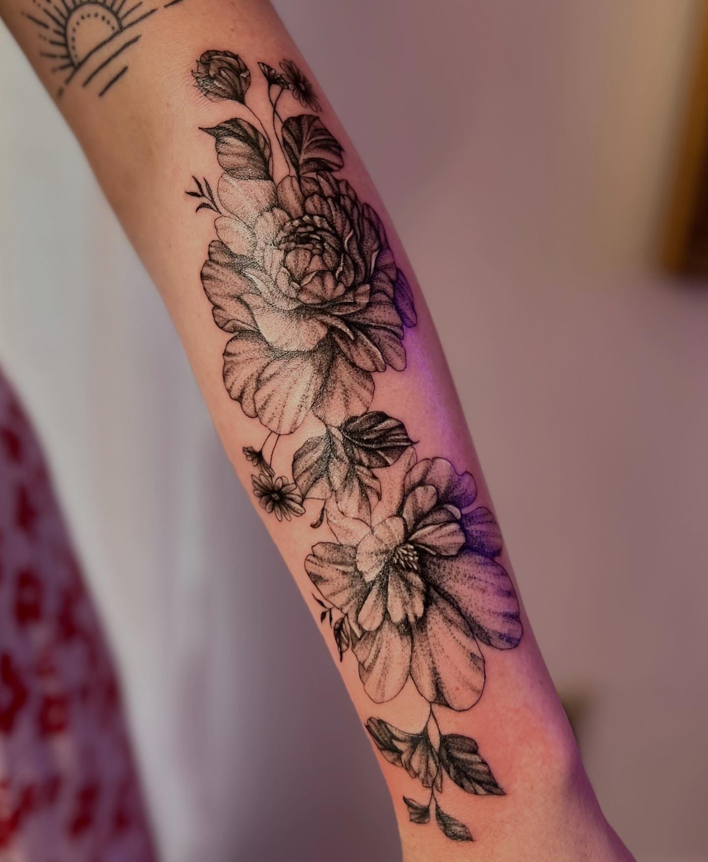 Floral bouquet dotwork tattoo on the forearm by πππ¦