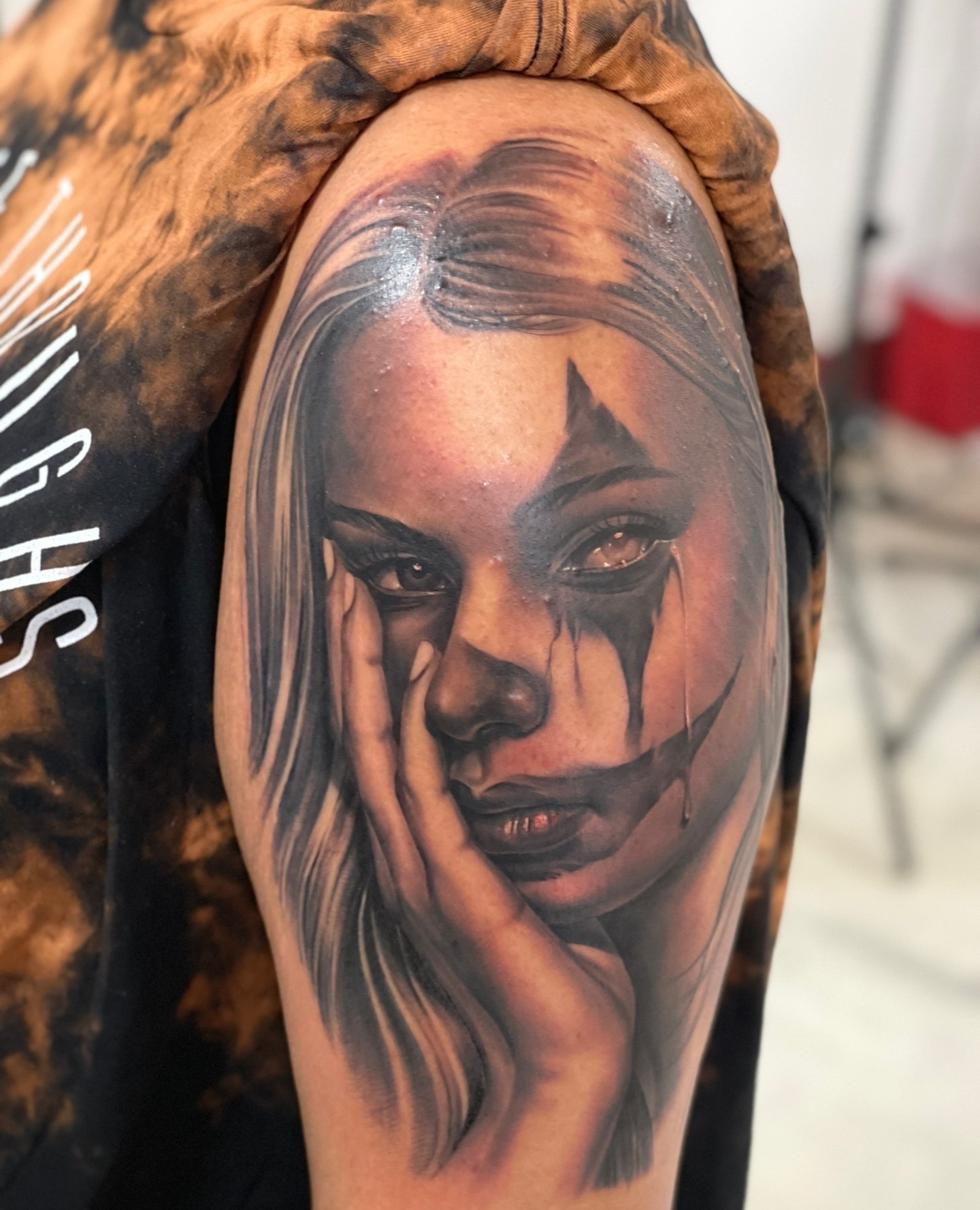 Woman with tears realism tattoo on the shoulder by Anthony Michaels, Tucson, Arizona