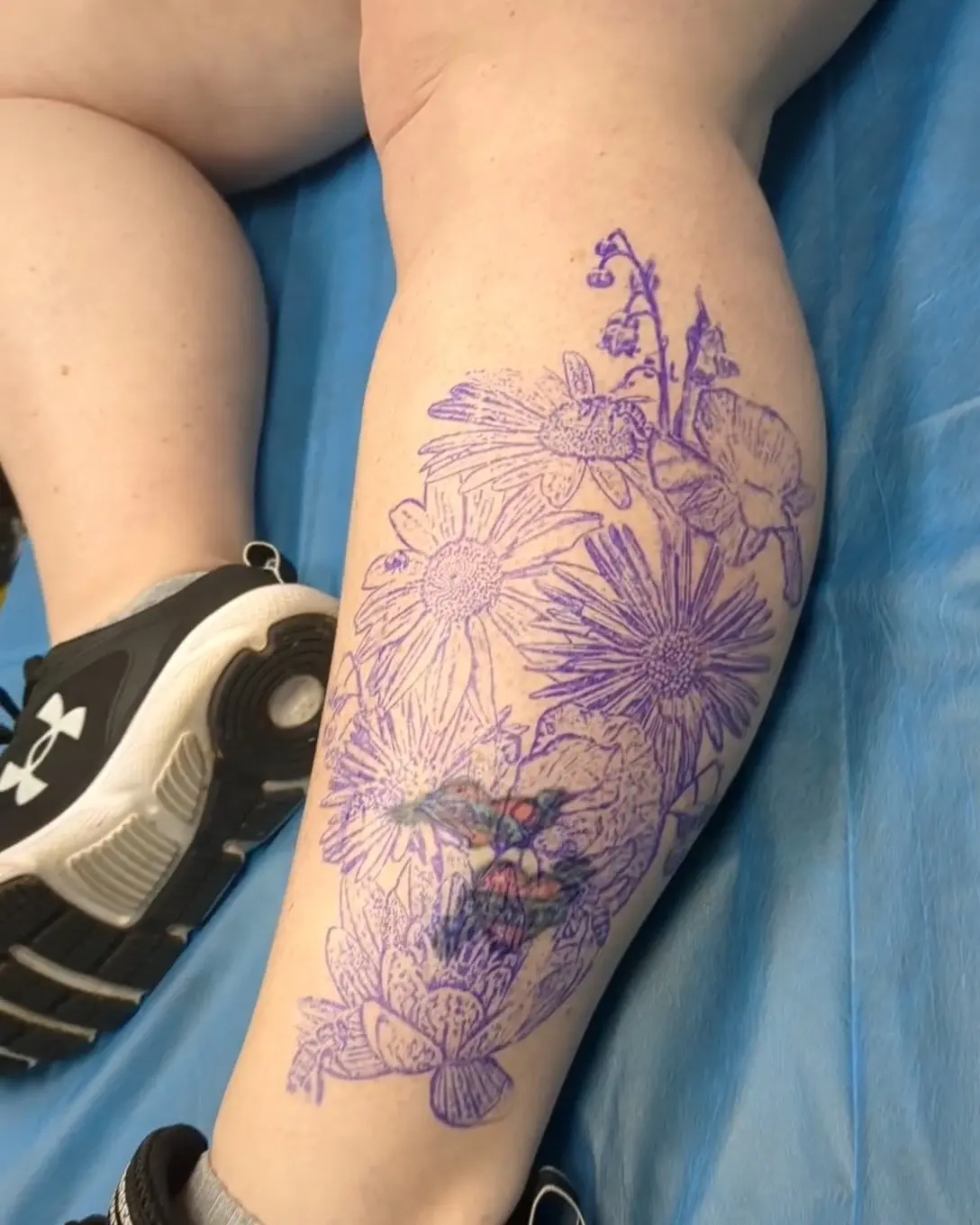 Floral bouquet dotwork tattoo on the thigh by Kara Falcon