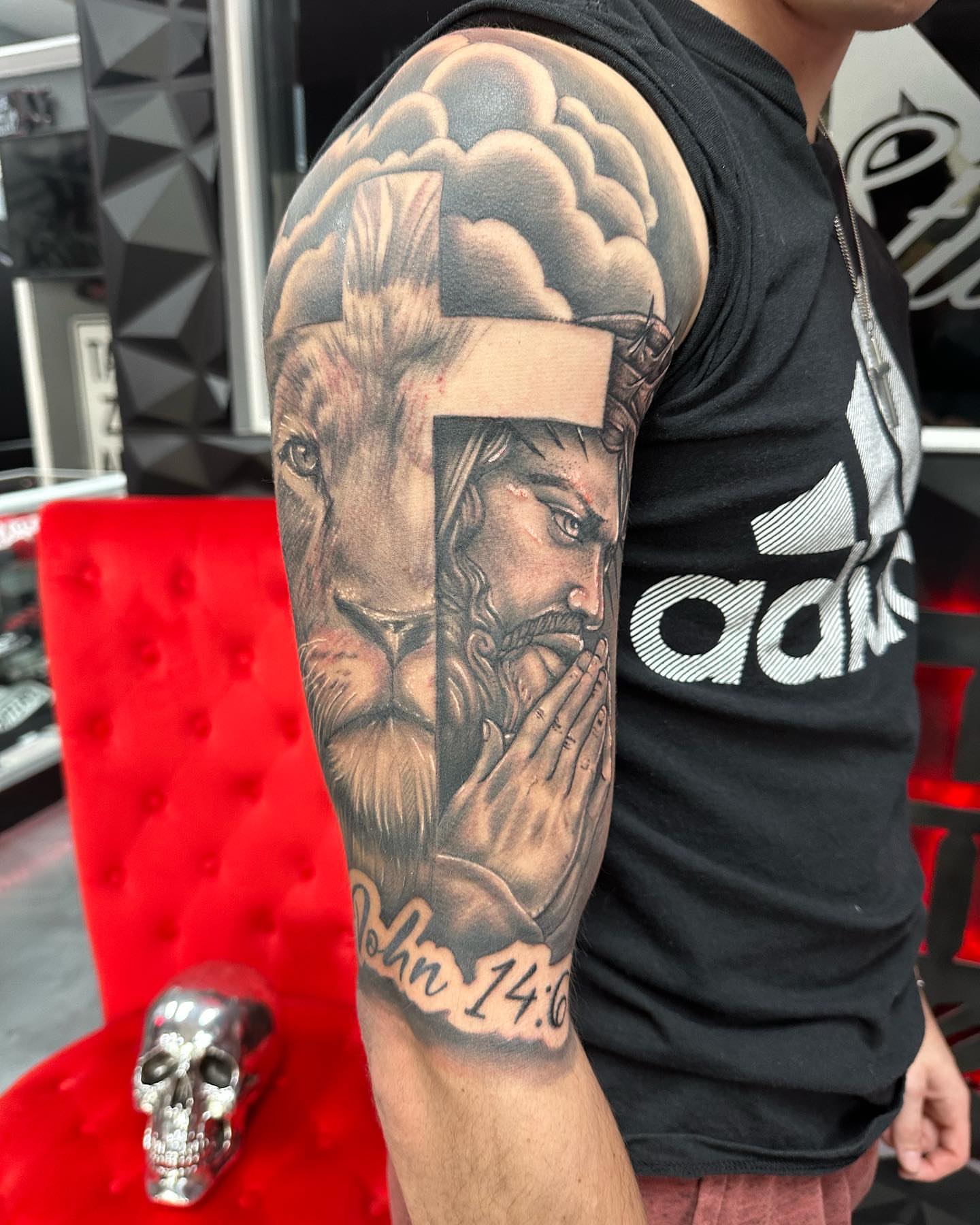Lion and man realism tattoo on the forearm by Pablo Venegas