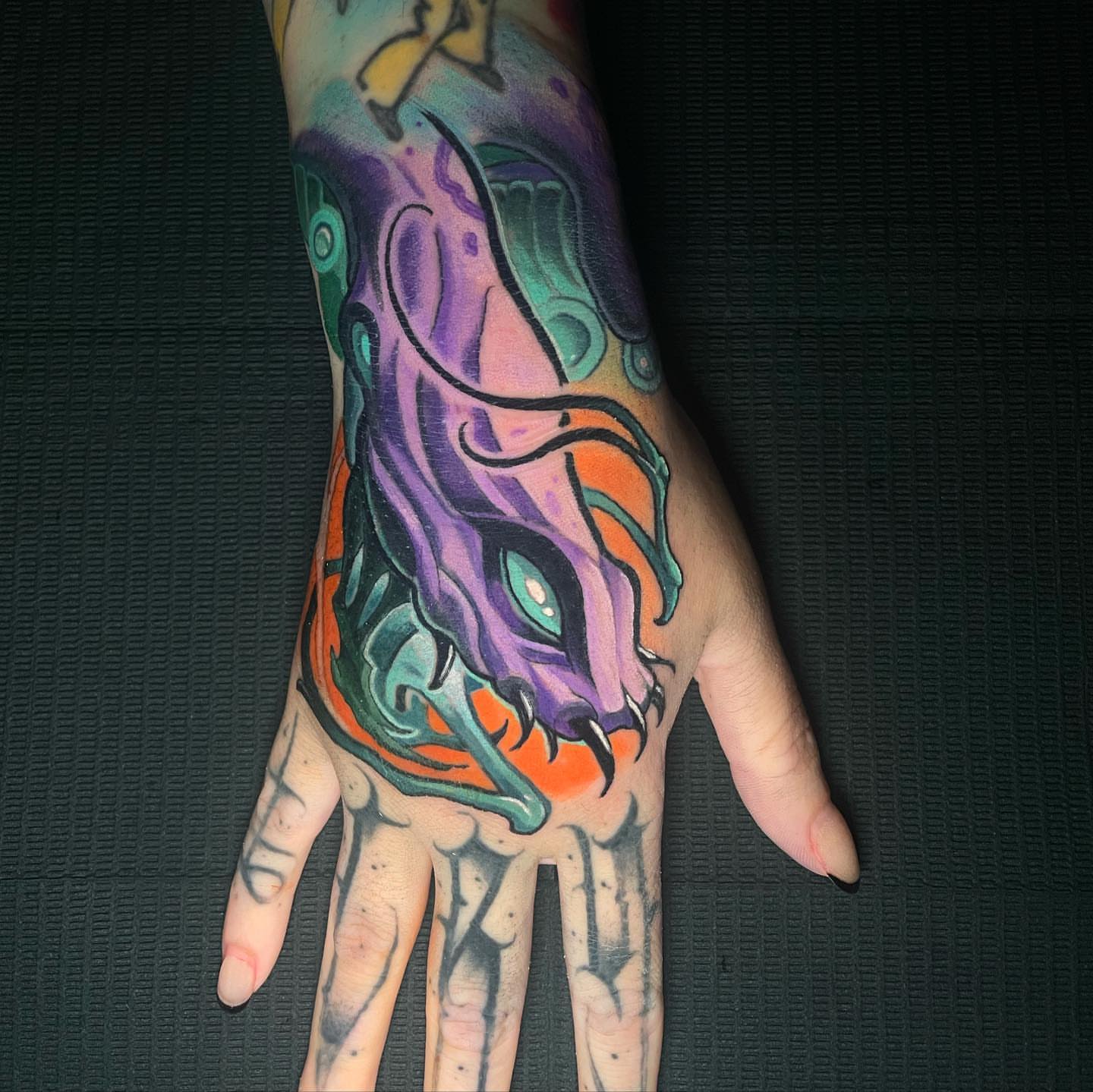 Monster new school tattoo on the hand by Zoe "Z" Fisk