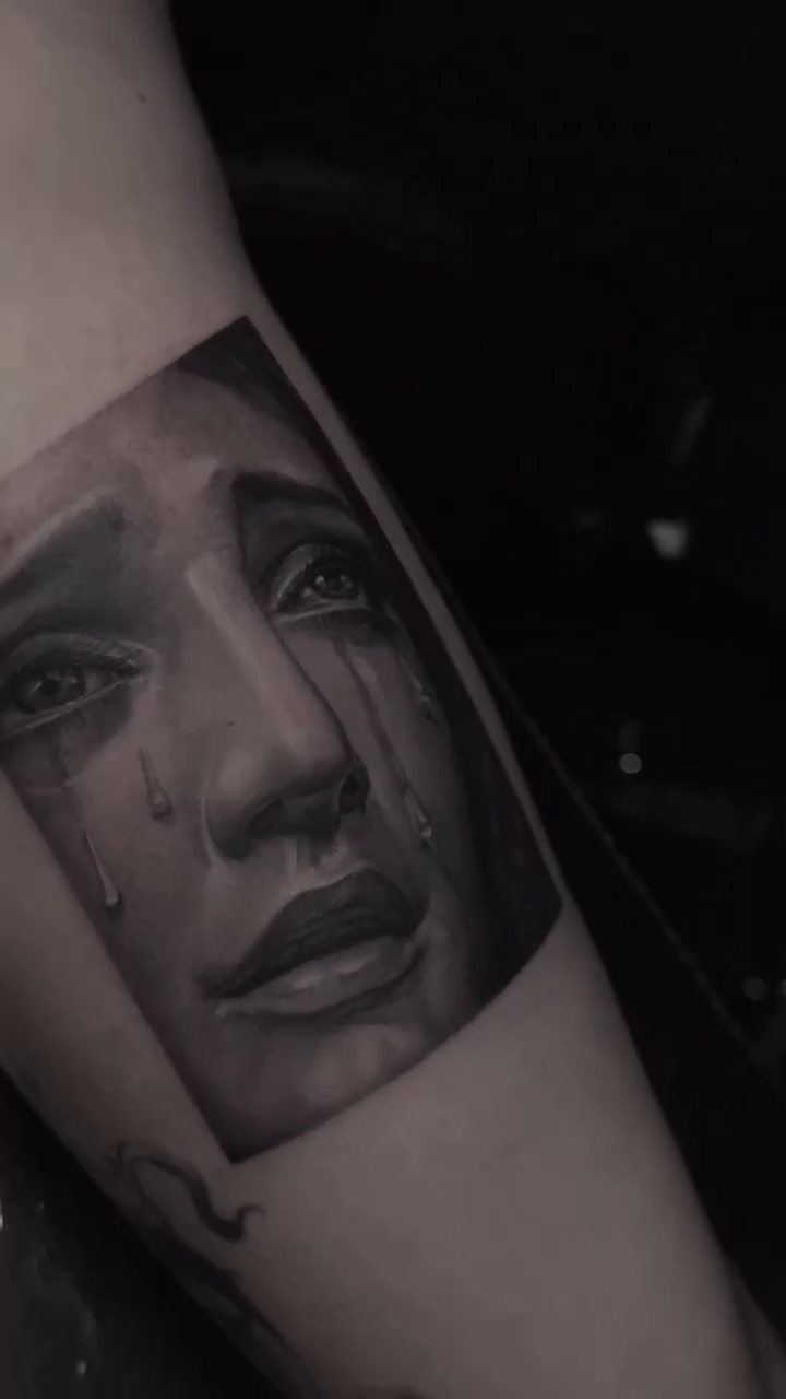 Crying woman's face realism tattoo by Paige Jean