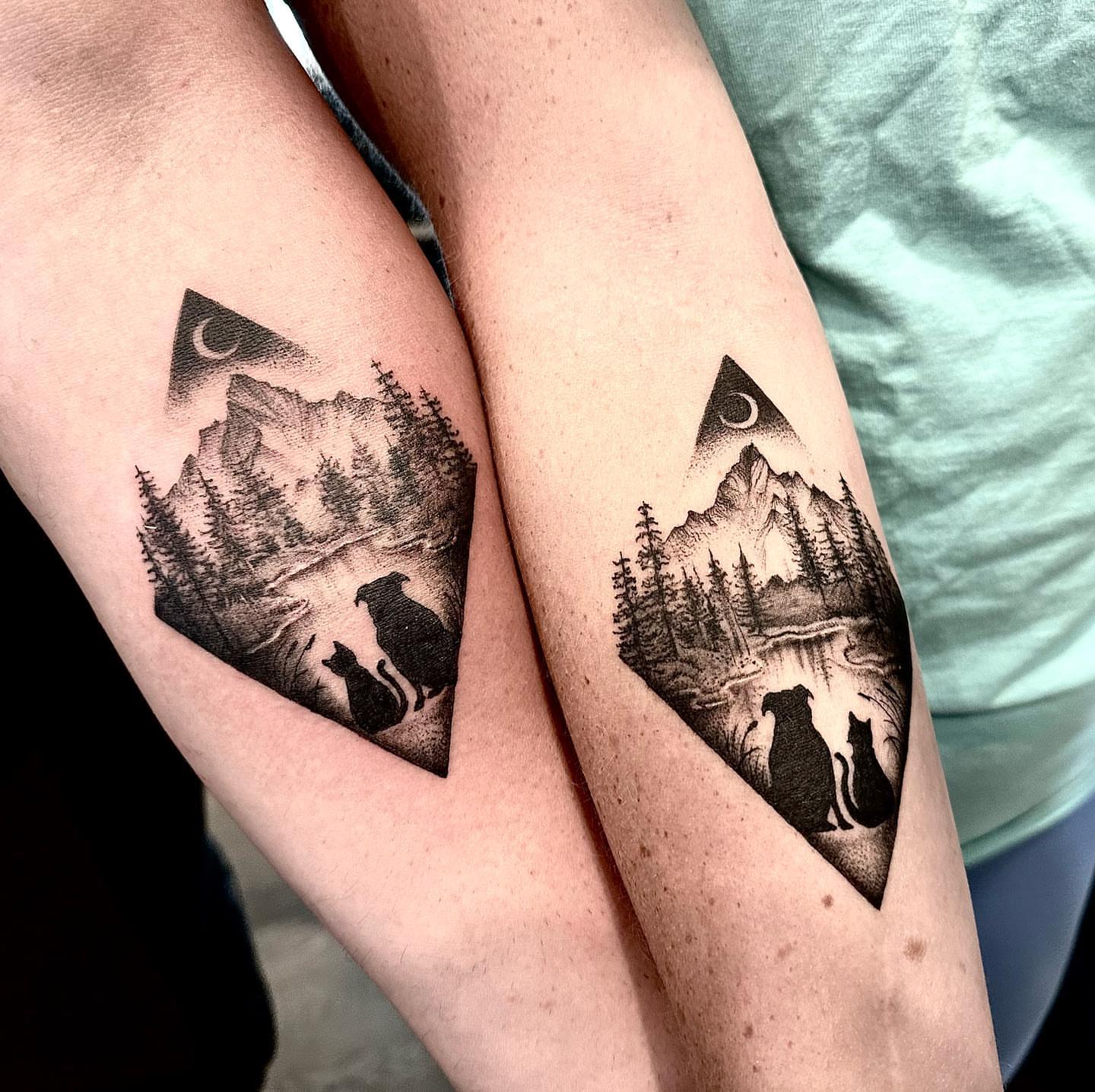 Mountain landscape black and grey tattoo on the forearm by Matthew Clanin