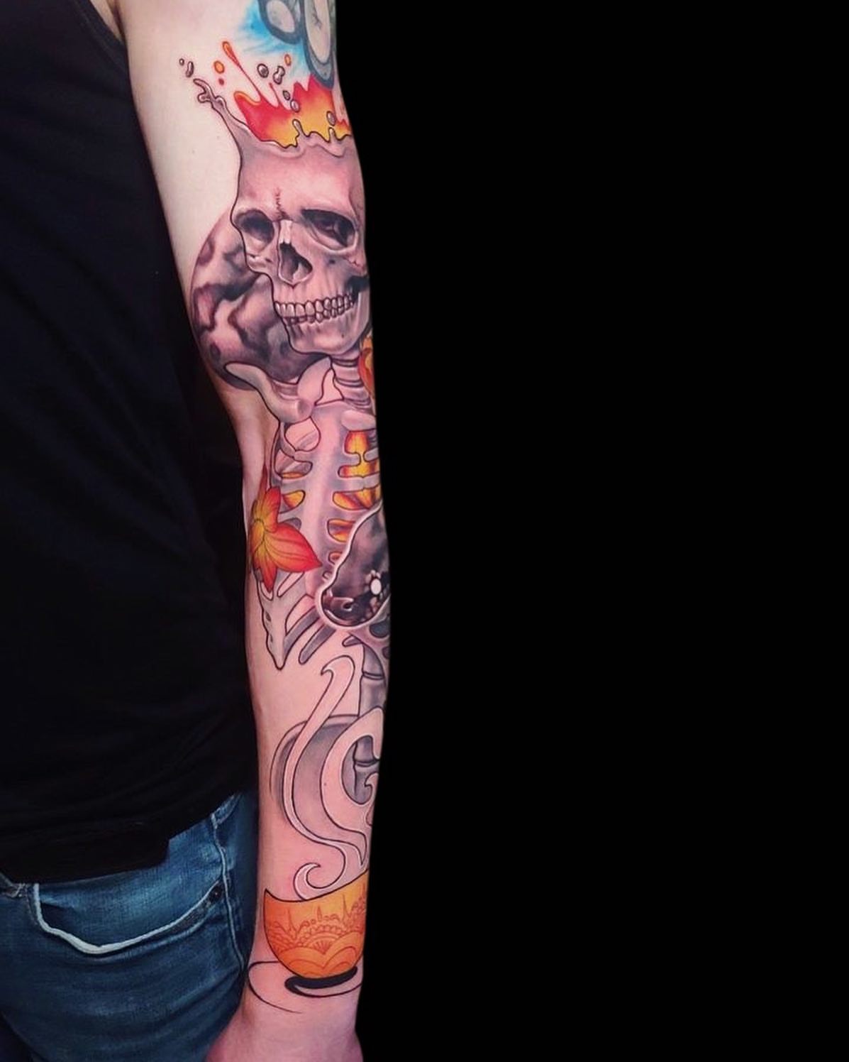 Skull and flame new school tattoo on the forearm by Rain Delmar