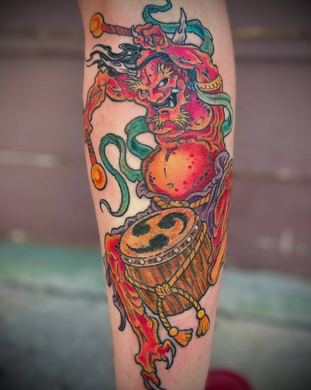 Lion and drum American traditional tattoo on the forearm by Culleton Paramore