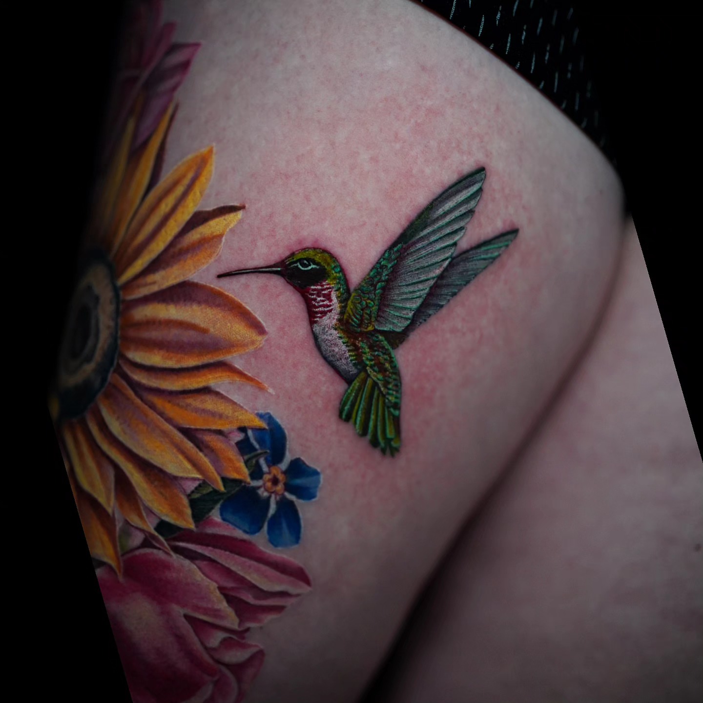 Hummingbird and sunflower realism tattoo on the thigh by Shar - Utah Tattoo Artist