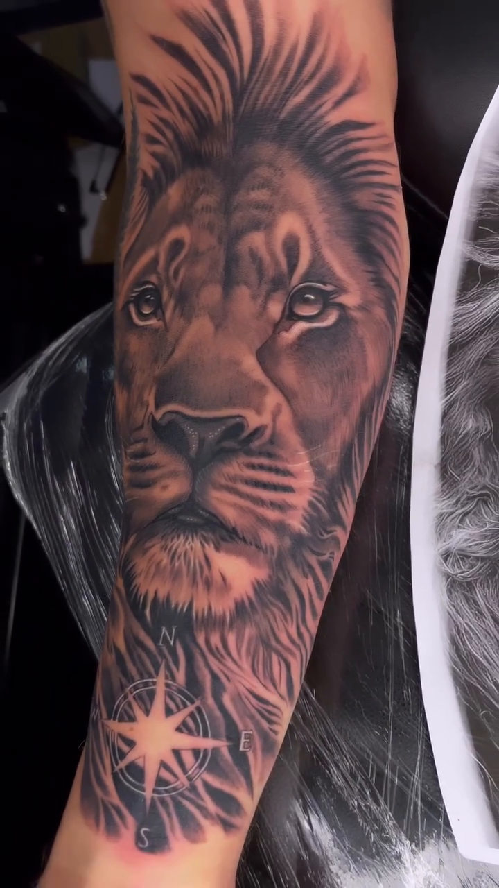 Lion portrait with star realism tattoo by Tam Nguyen