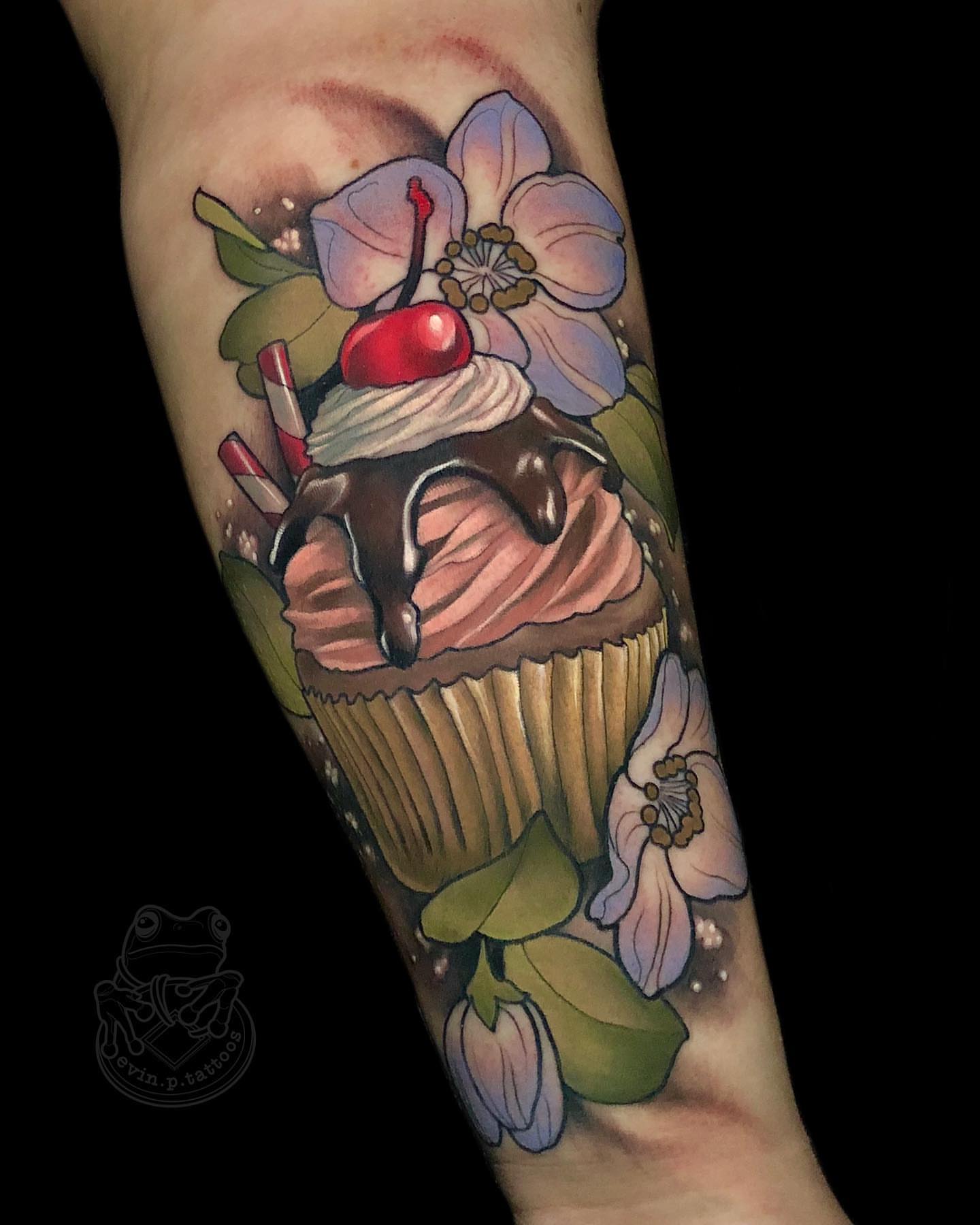Cupcake with cherry American traditional tattoo on the forearm by Evin Pfaff, Bedford, Pennsylvania