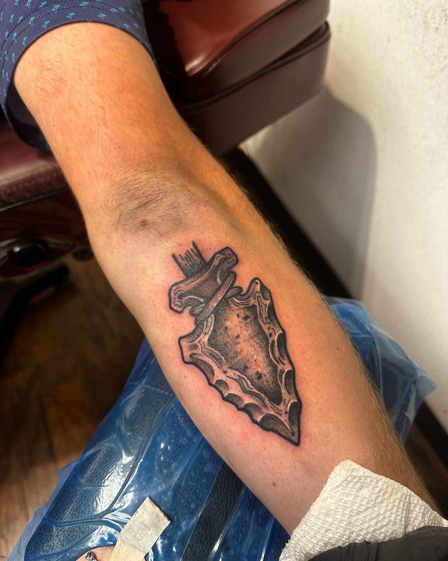 Shield black and grey tattoo on the forearm by Kassie Perian
