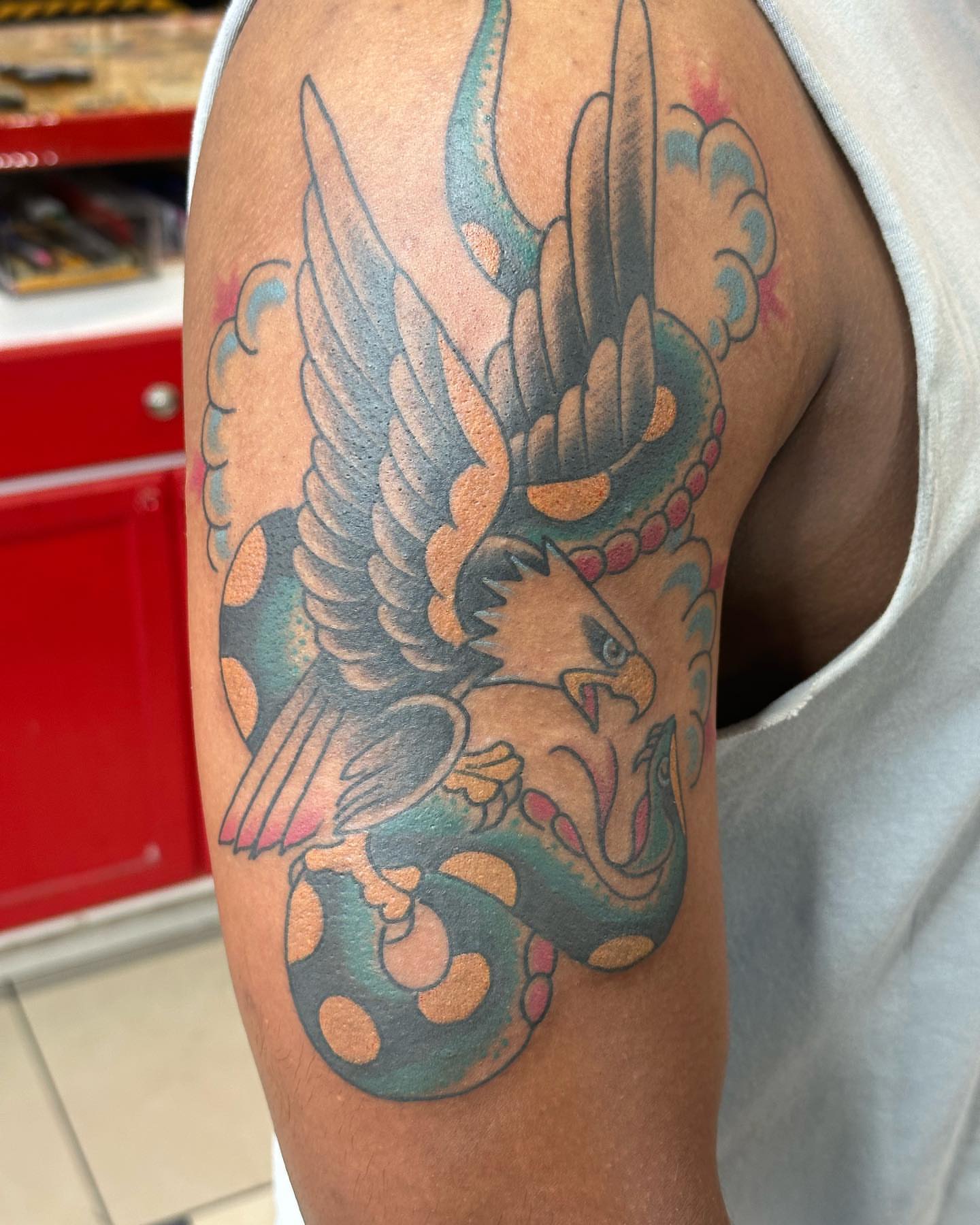 Eagle and snake American traditional tattoo on the upper arm by David Steed, Dallas, Texas