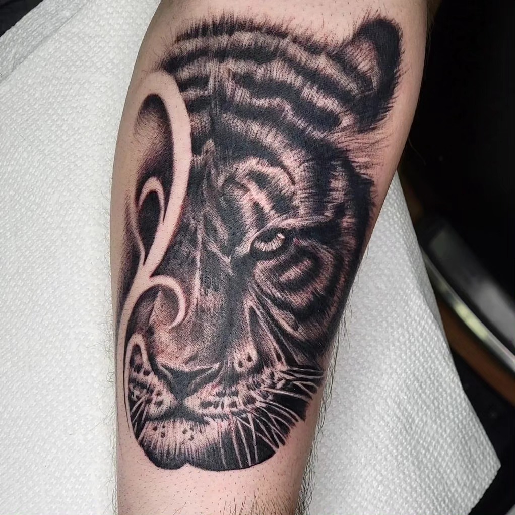 Tiger realism tattoo on the forearm by BZ Artistry