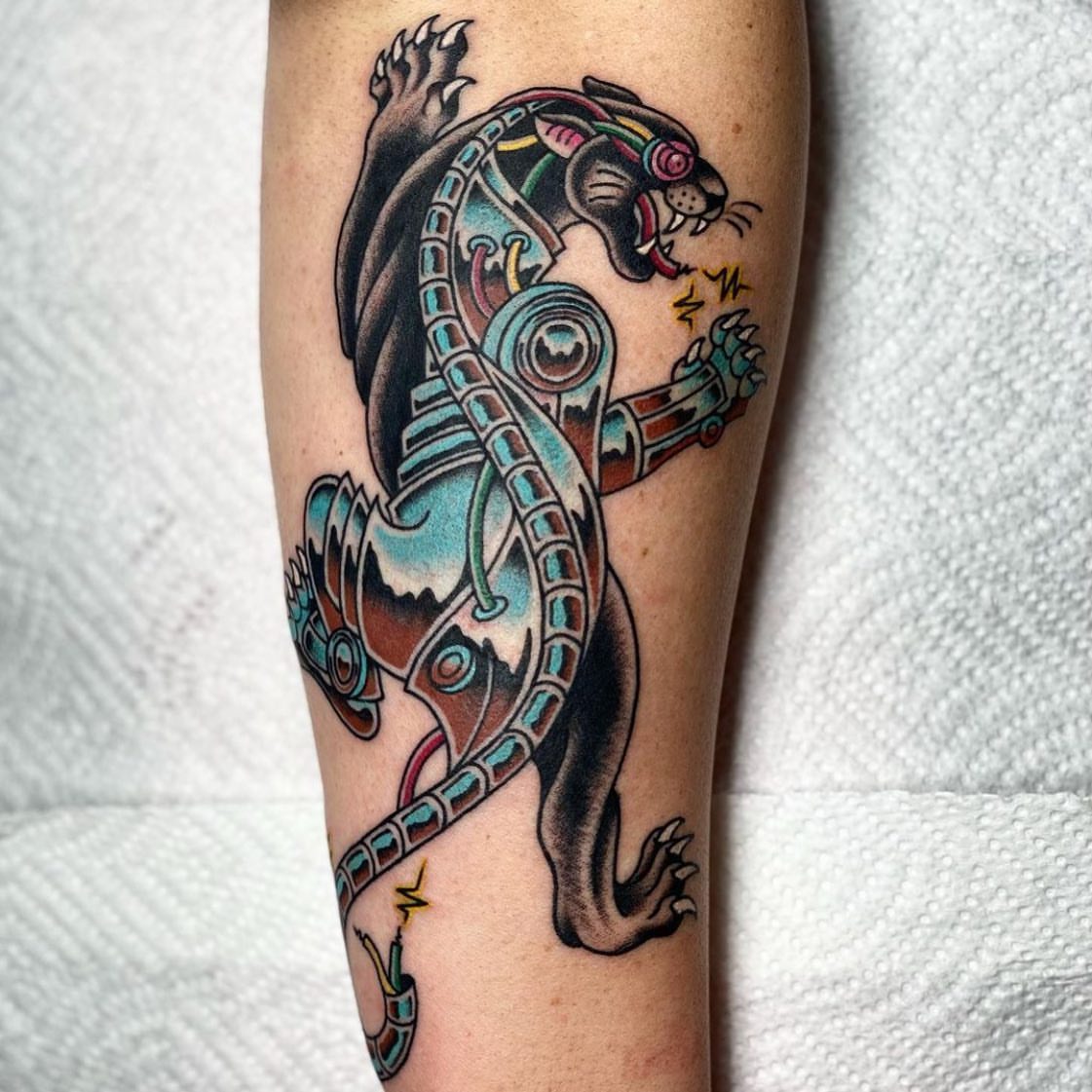 Panther American traditional tattoo on the forearm by Chelstine, Encinitas, California