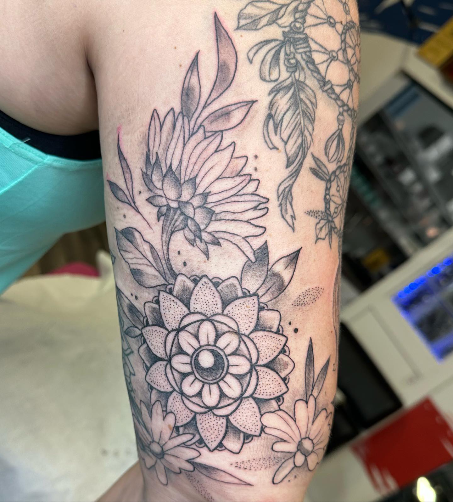 Floral arrangement dotwork tattoo on the forearm by Halle Haas