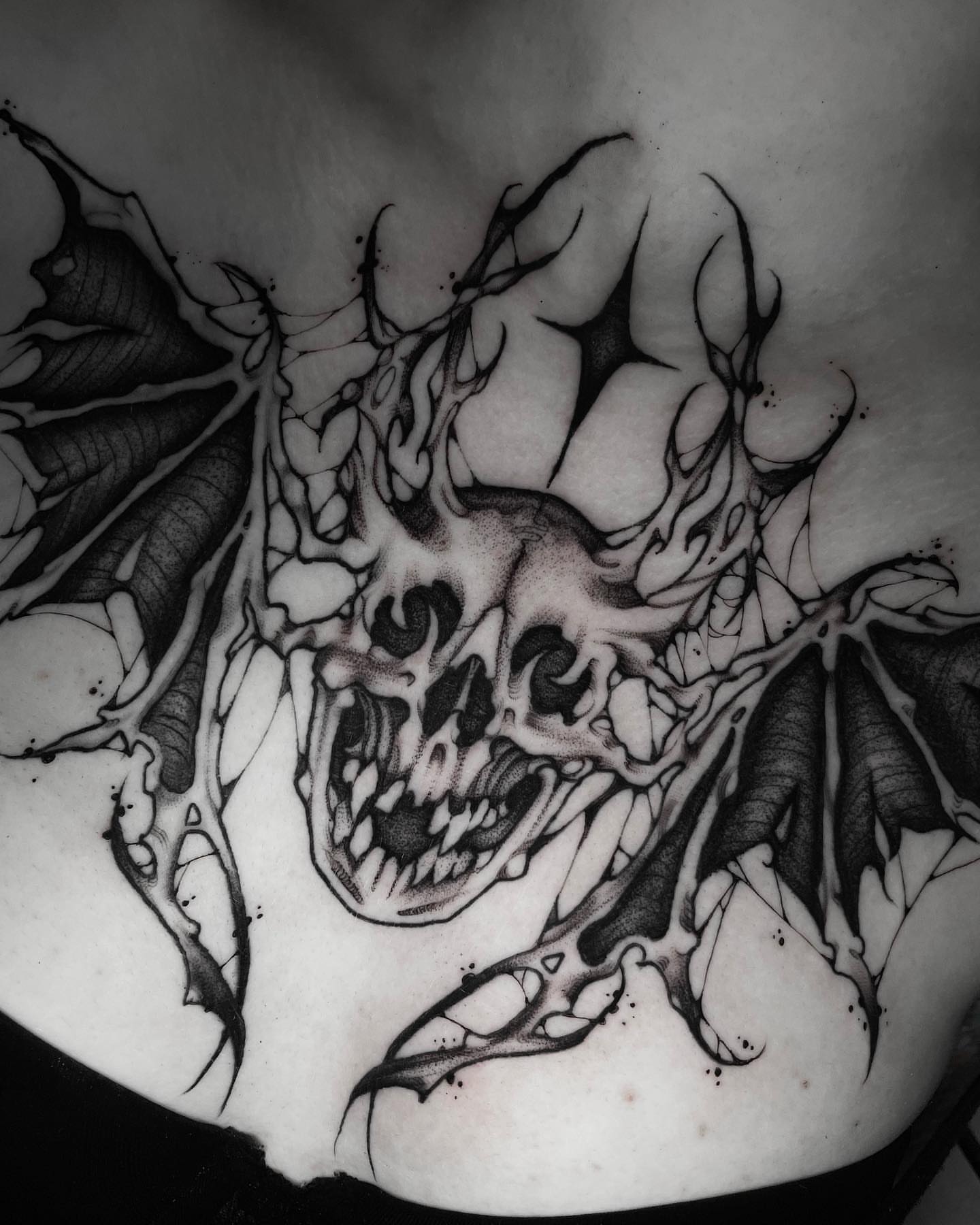 Screaming skull dark realism tattoo on the chest by Sofia Rose