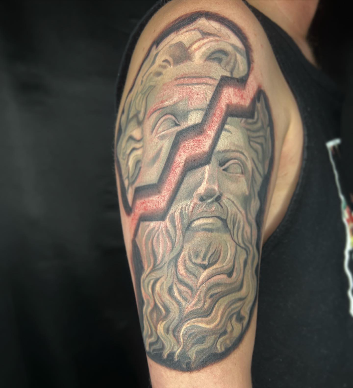 God-like face realism tattoo on the shoulder by Daphne Landry