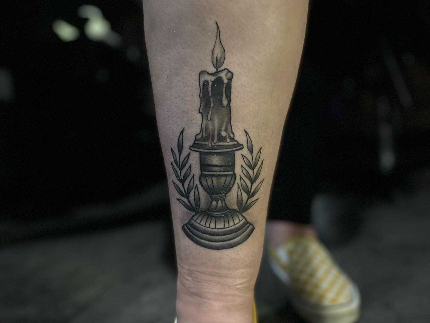 Candle black and grey tattoo on the forearm by Brian Keith