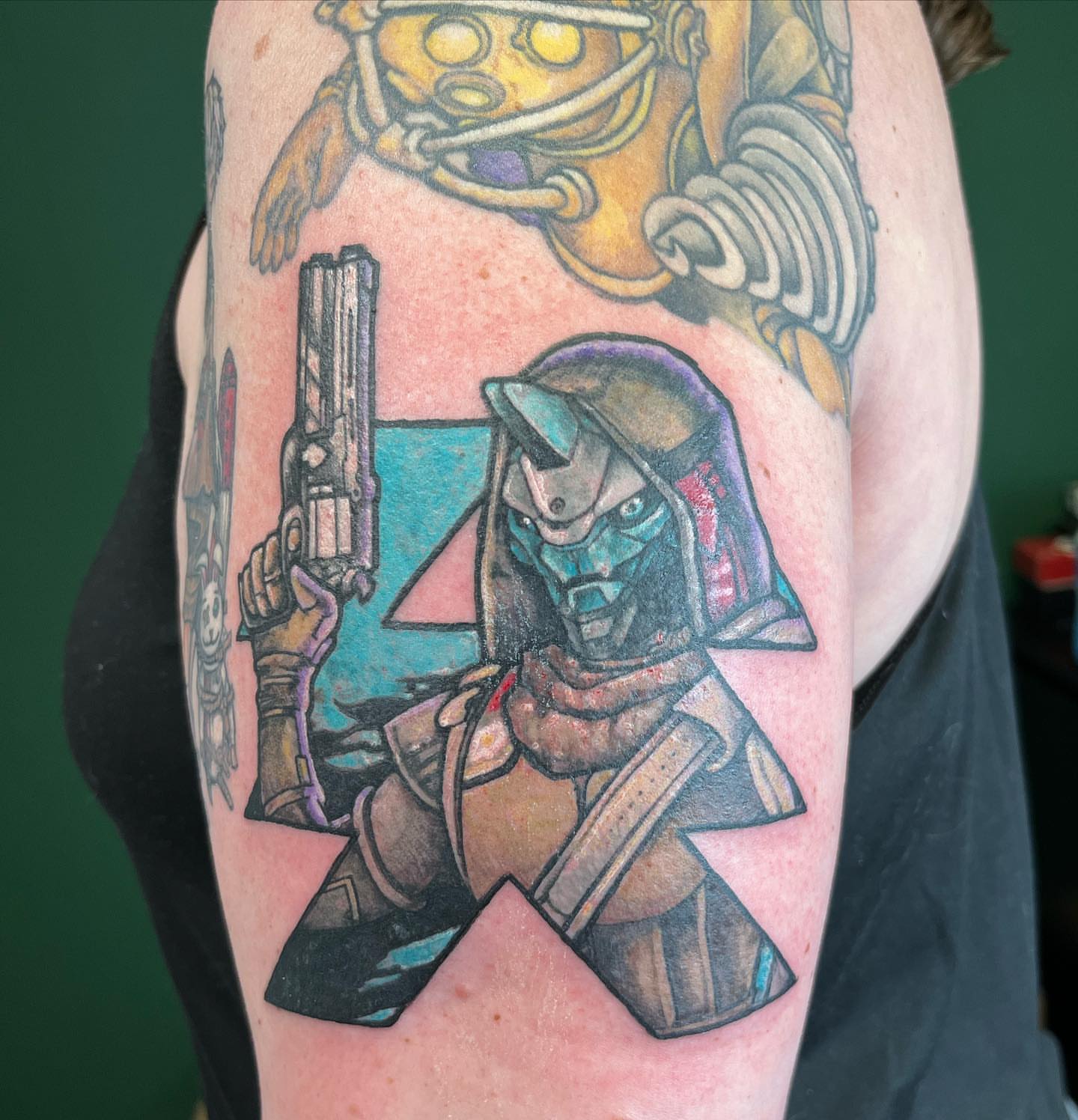 Mecha soldier anime tattoo on the upper arm by Nason Dilts