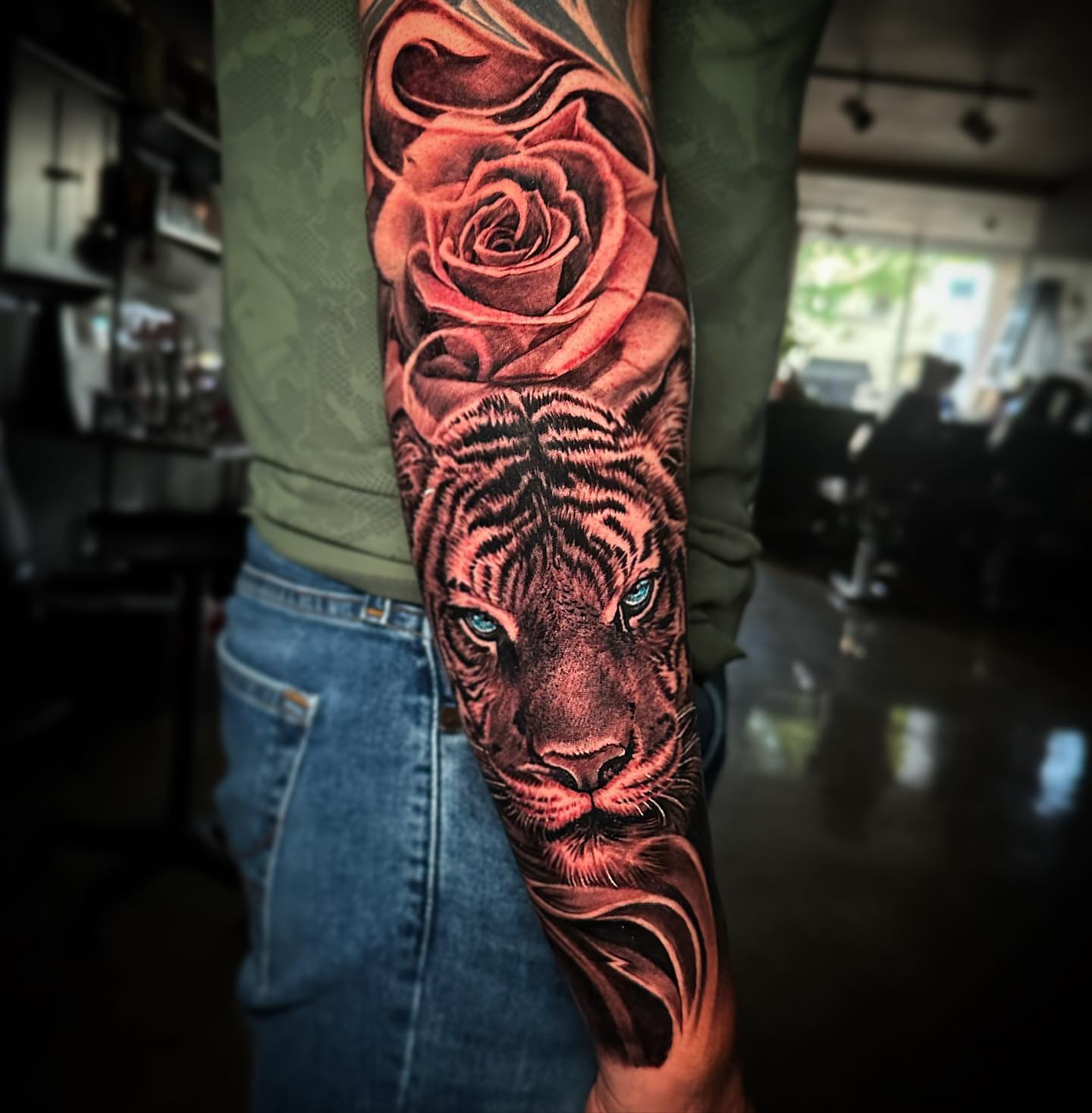 Tiger and rose realism tattoo on the forearm by Christian Medina, Sacramento, California