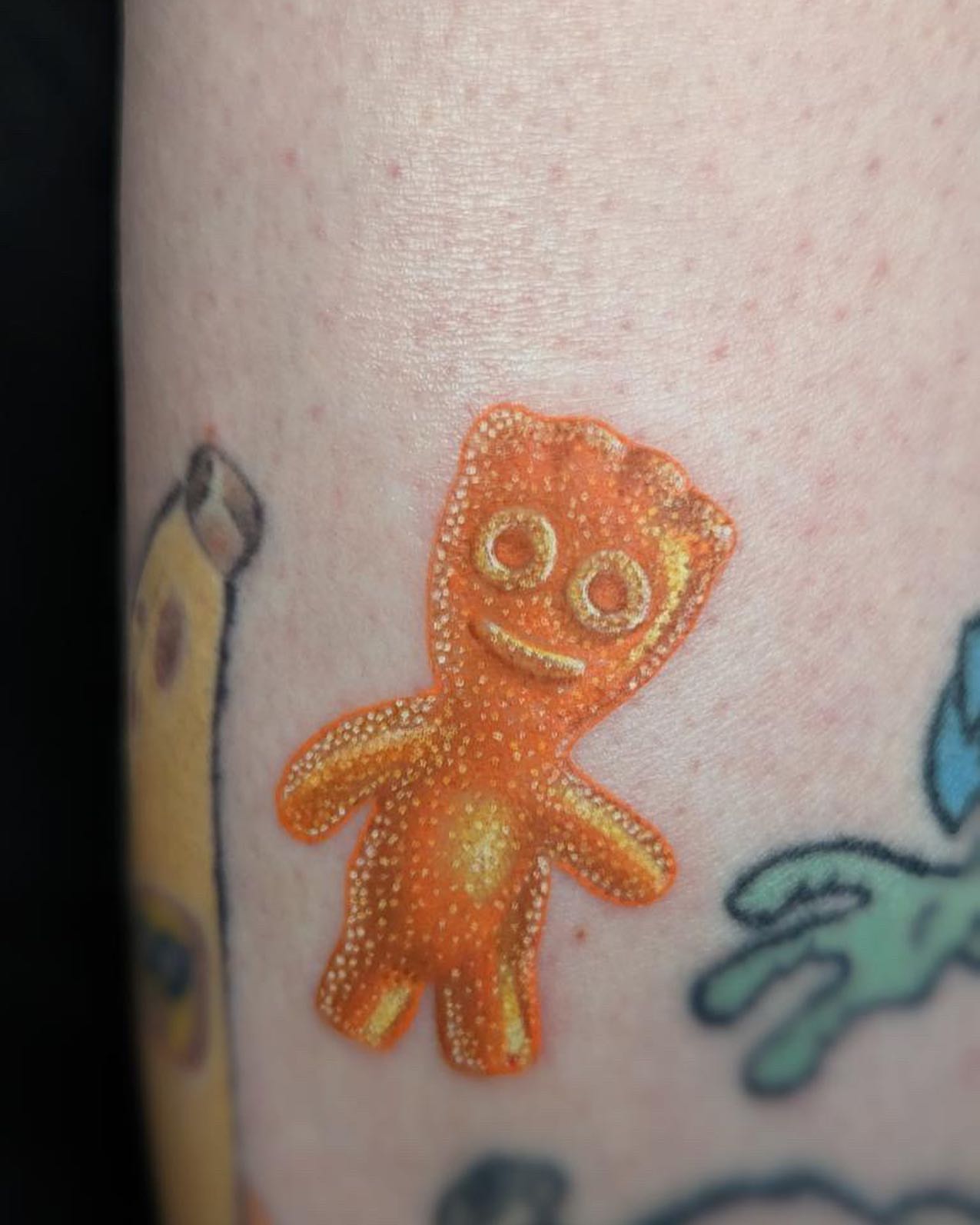 Gingerbread man dotwork tattoo on the forearm by CHiNO iNKs