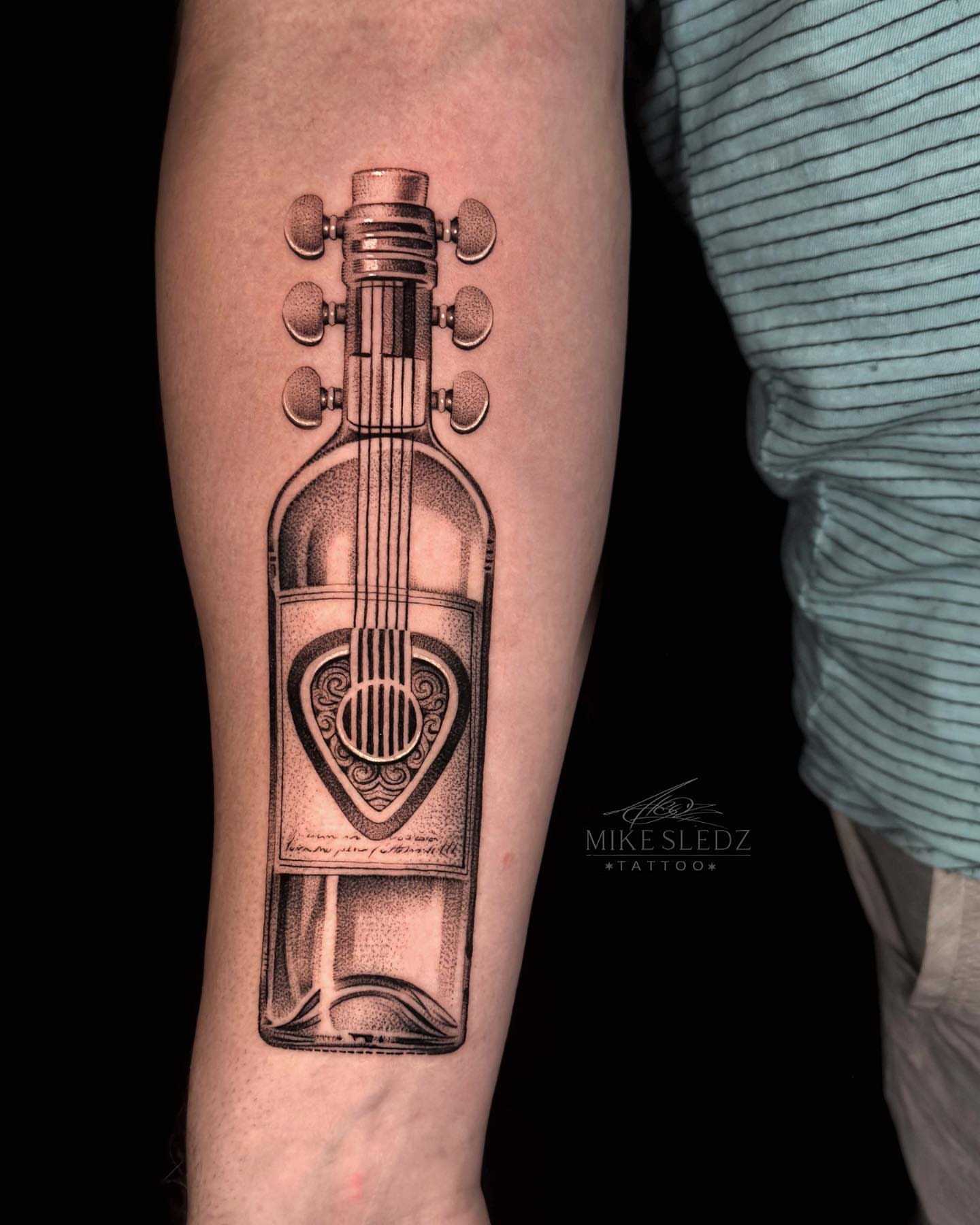Guitar bottle dotwork tattoo on the forearm by ✶ MIKE SLEDZ ✶ Chicago Tattoo Artist