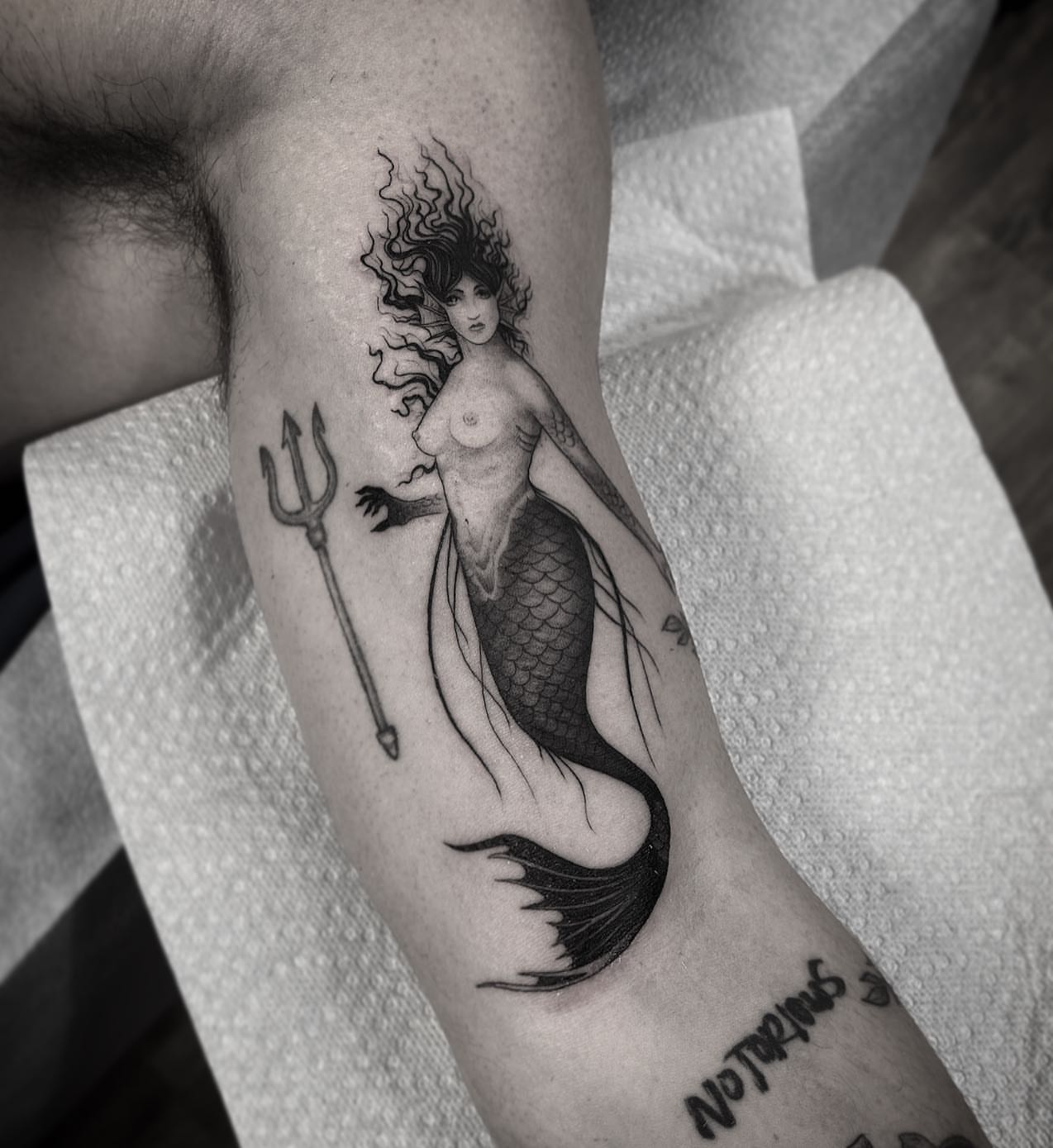Mermaid realism tattoo on the forearm by Pat Moser