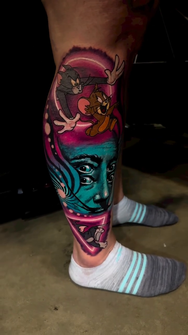 Surreal face with cartoon characters new school tattoo by Joseph Delaparra