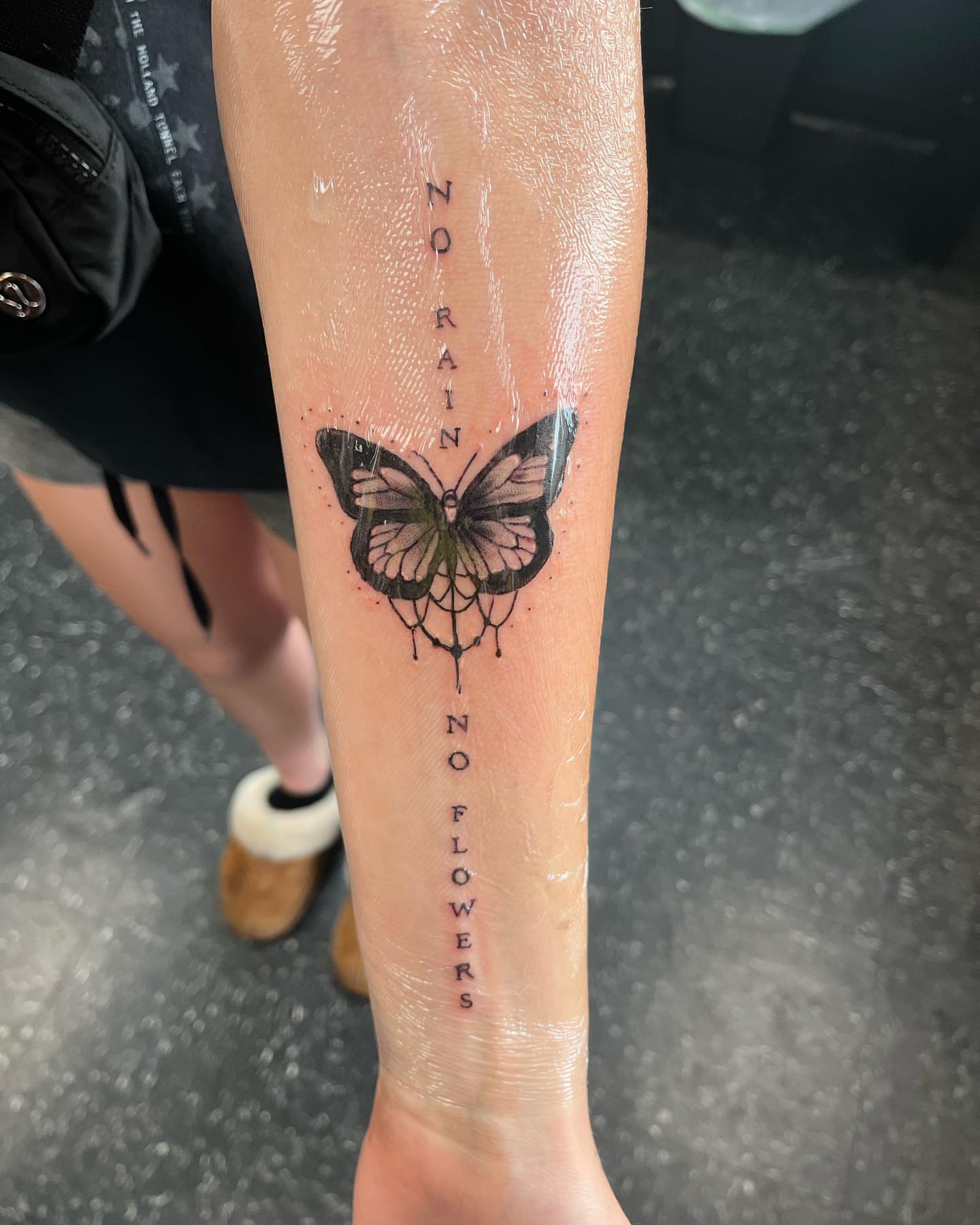 Butterfly dotwork tattoo on the calf by Alyssa Turner