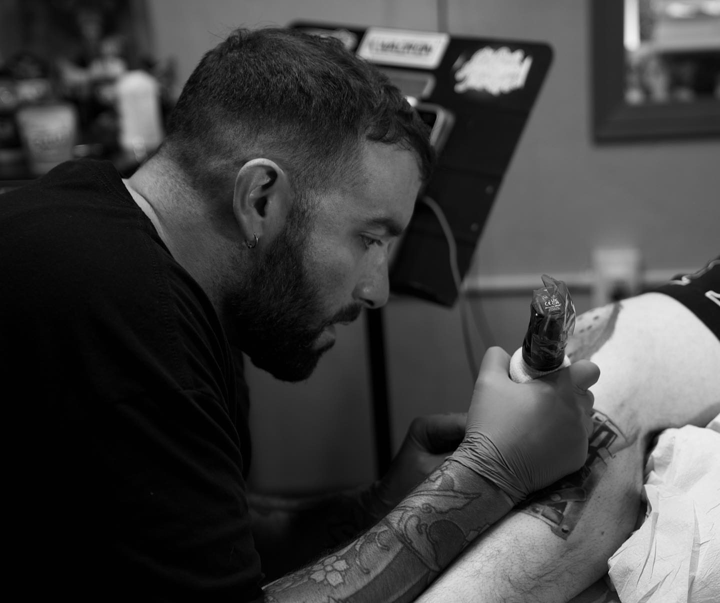 Tattoo artist black and grey tattoo on the upper arm by Antonio Massimino