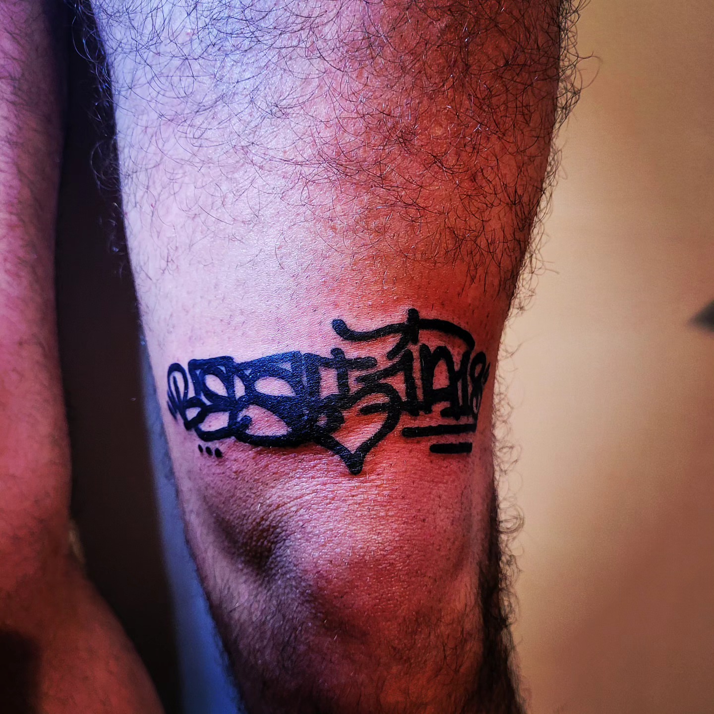 Graffiti-style lettering tattoo on the forearm by Gonzalo Pantona