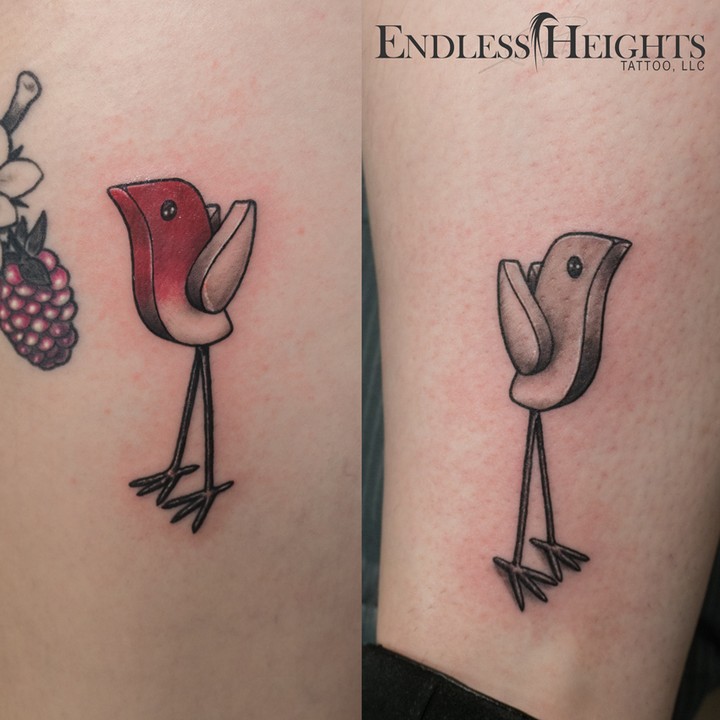 Stylized bird ignorant tattoo on the forearm by Donald Voelker