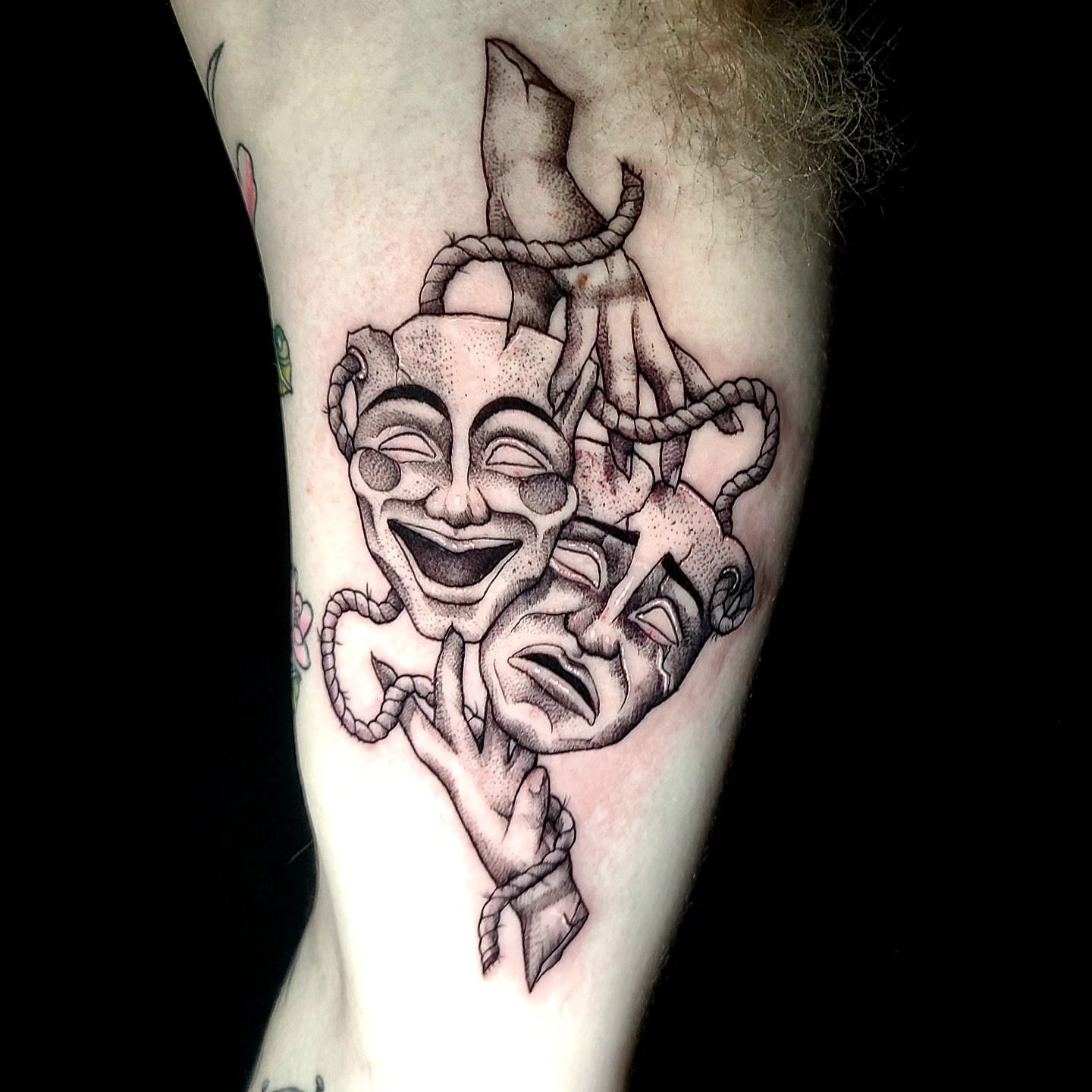 Theatrical masks dotwork tattoo on the forearm by Sydney Paige, Mentor, Ohio