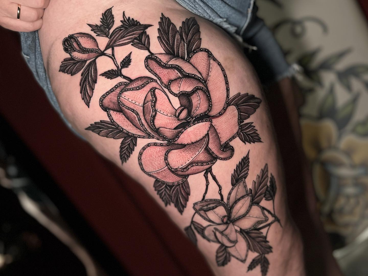 Rose American traditional tattoo on the thigh by Morgan Jones