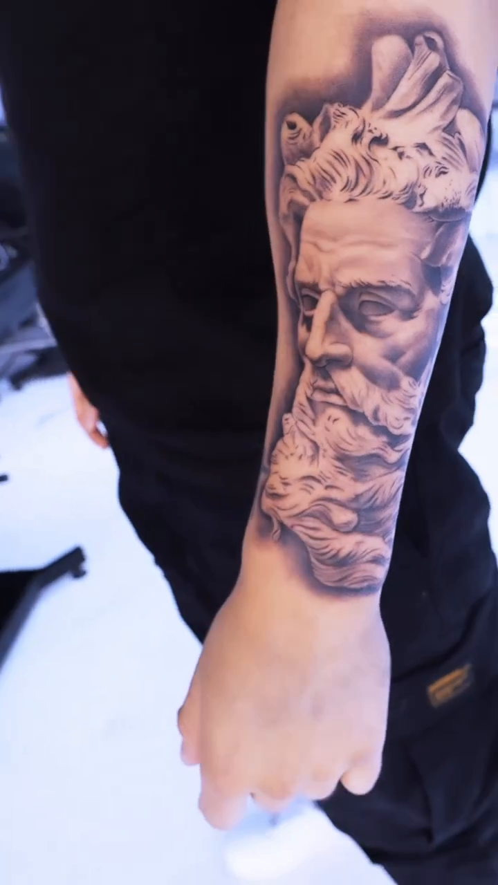 Bust of a classical figure realism tattoo by Artfabn