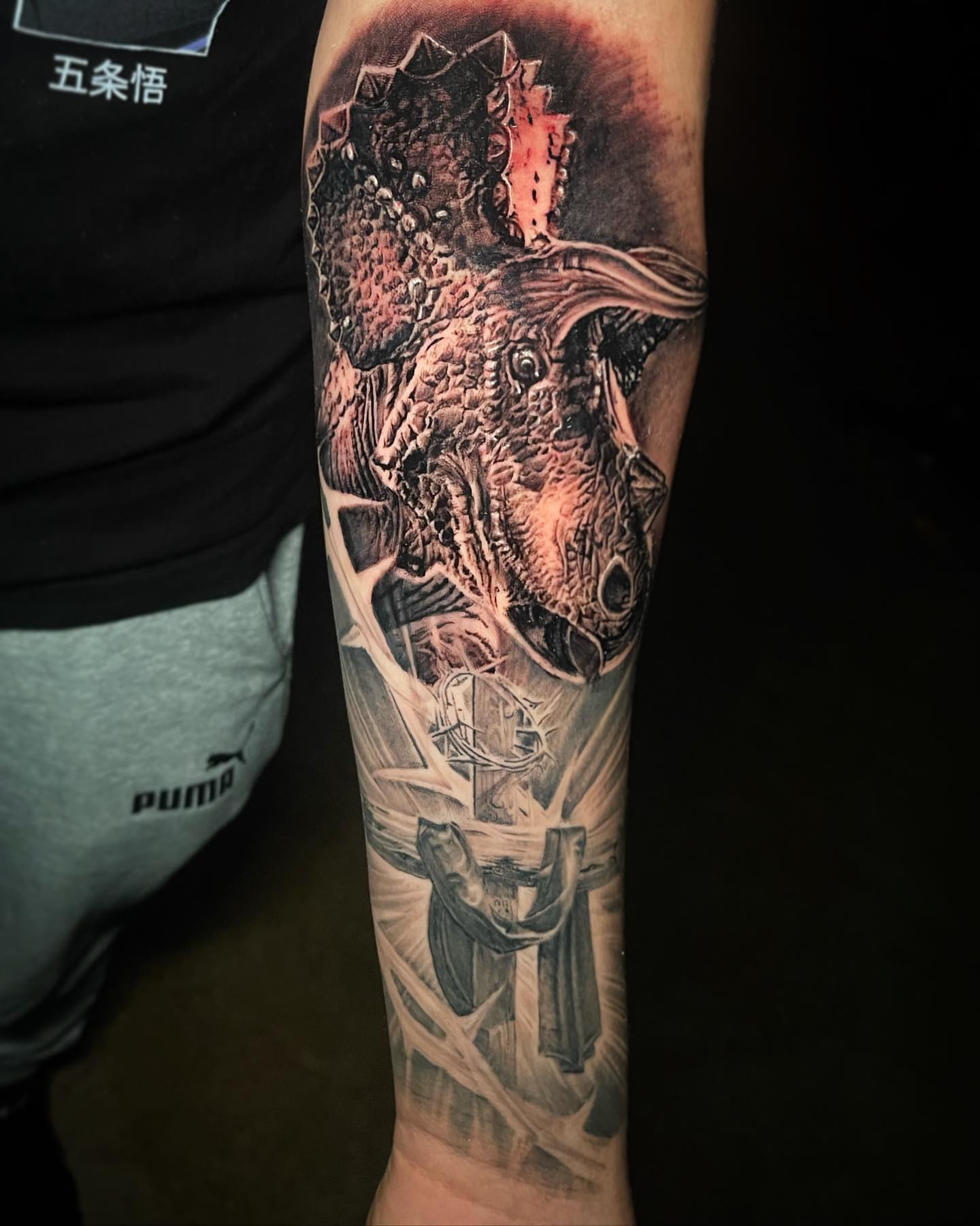 Dragon and cross realism tattoo on the forearm by Christian Medina, Sacramento, California