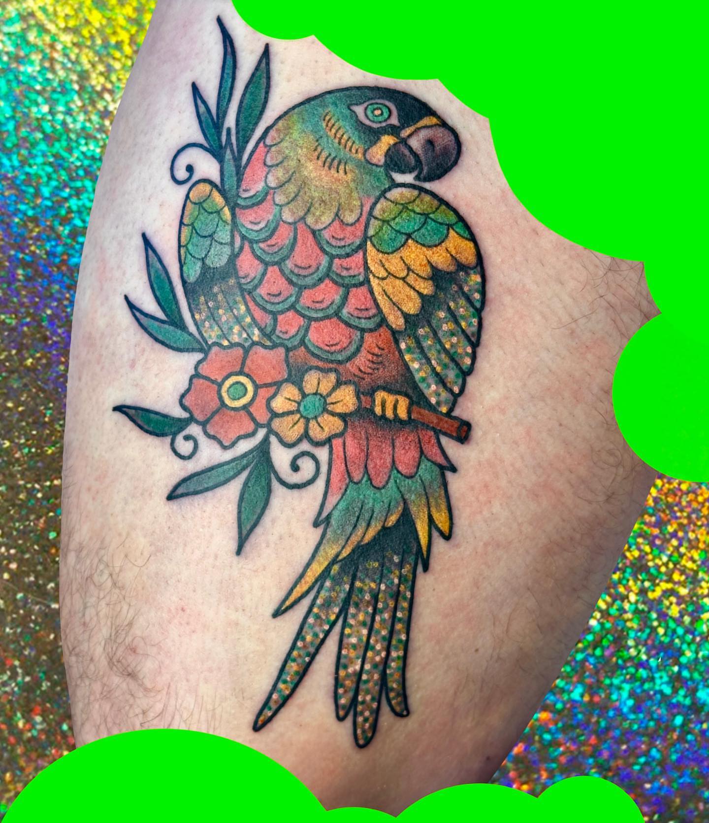 Parrot American traditional tattoo on the thigh by Chelsea Lane
