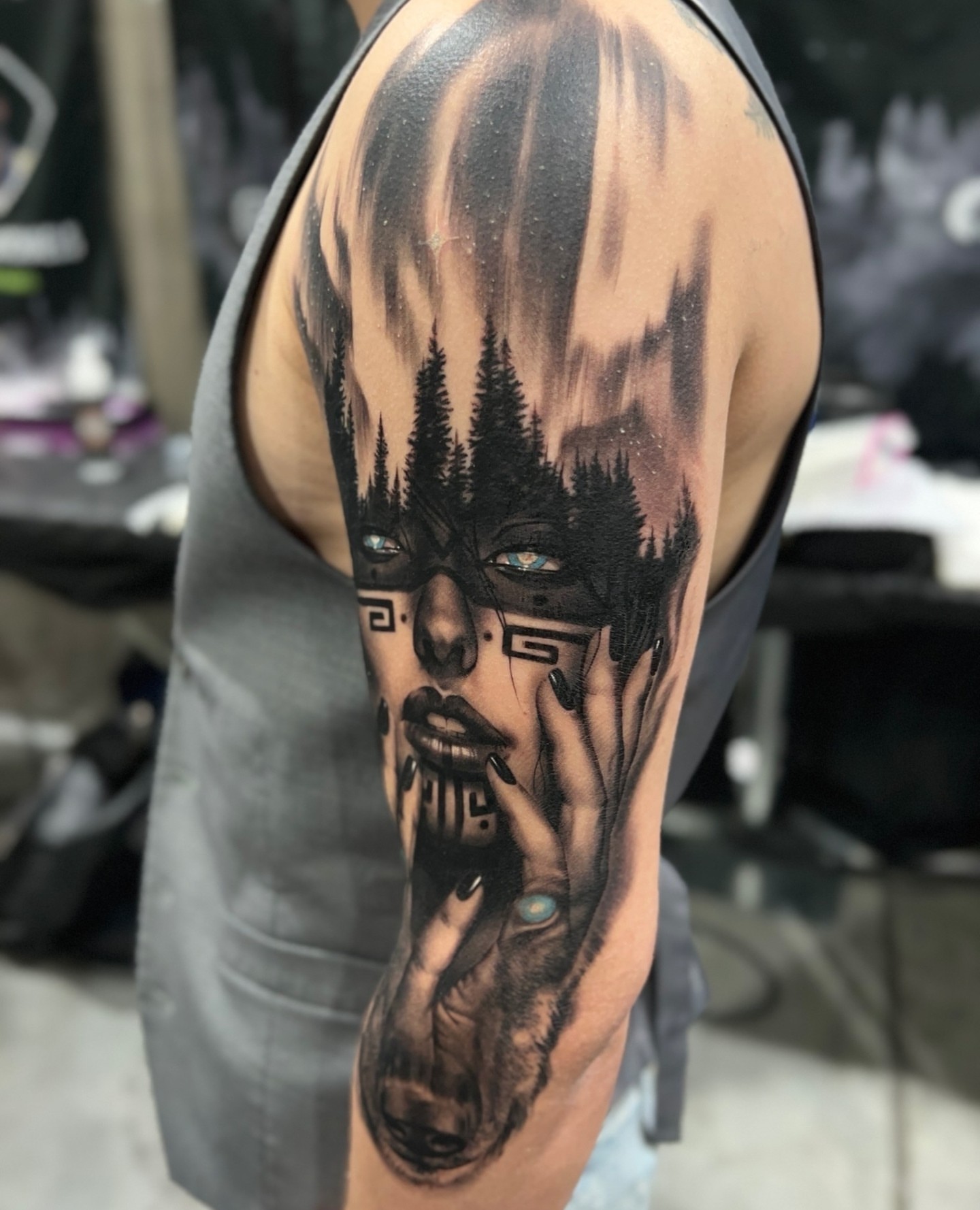 Forest and face realism tattoo on the upper arm by Anthony Michaels, Tucson, Arizona
