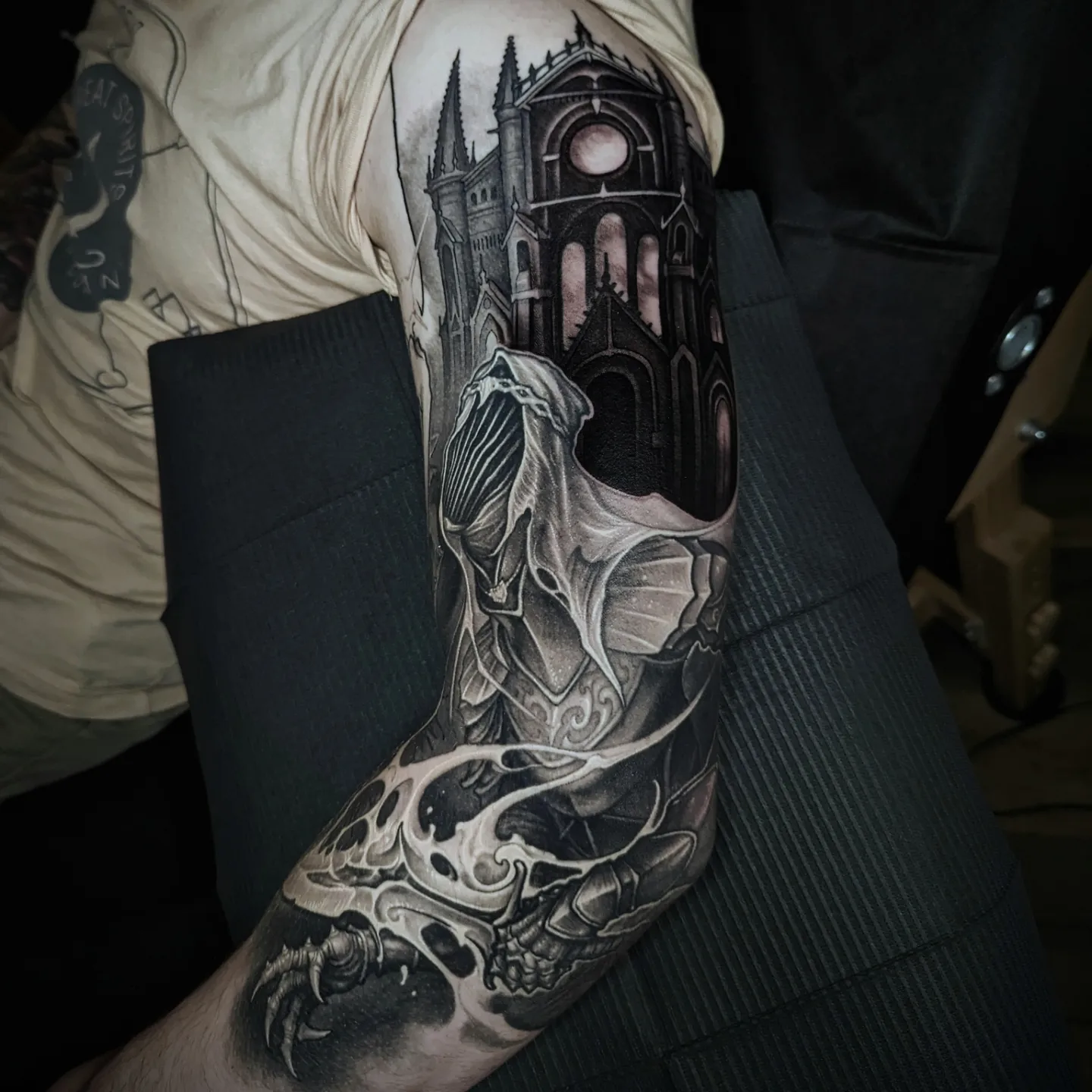 Gothic cathedral and skull dark realism tattoo on the forearm by Matt Driscoll