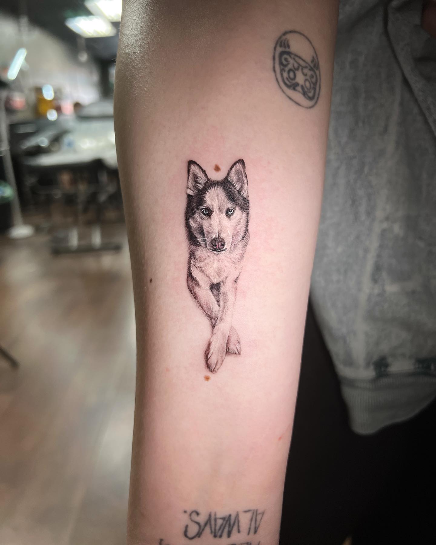 Husky dog realism tattoo on the forearm by Nana