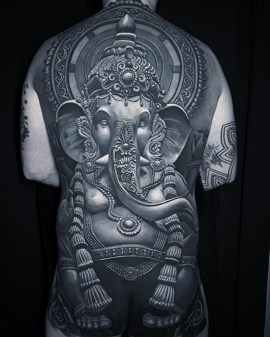 Ganesha geometric tattoo on the back by Gabriel Londis