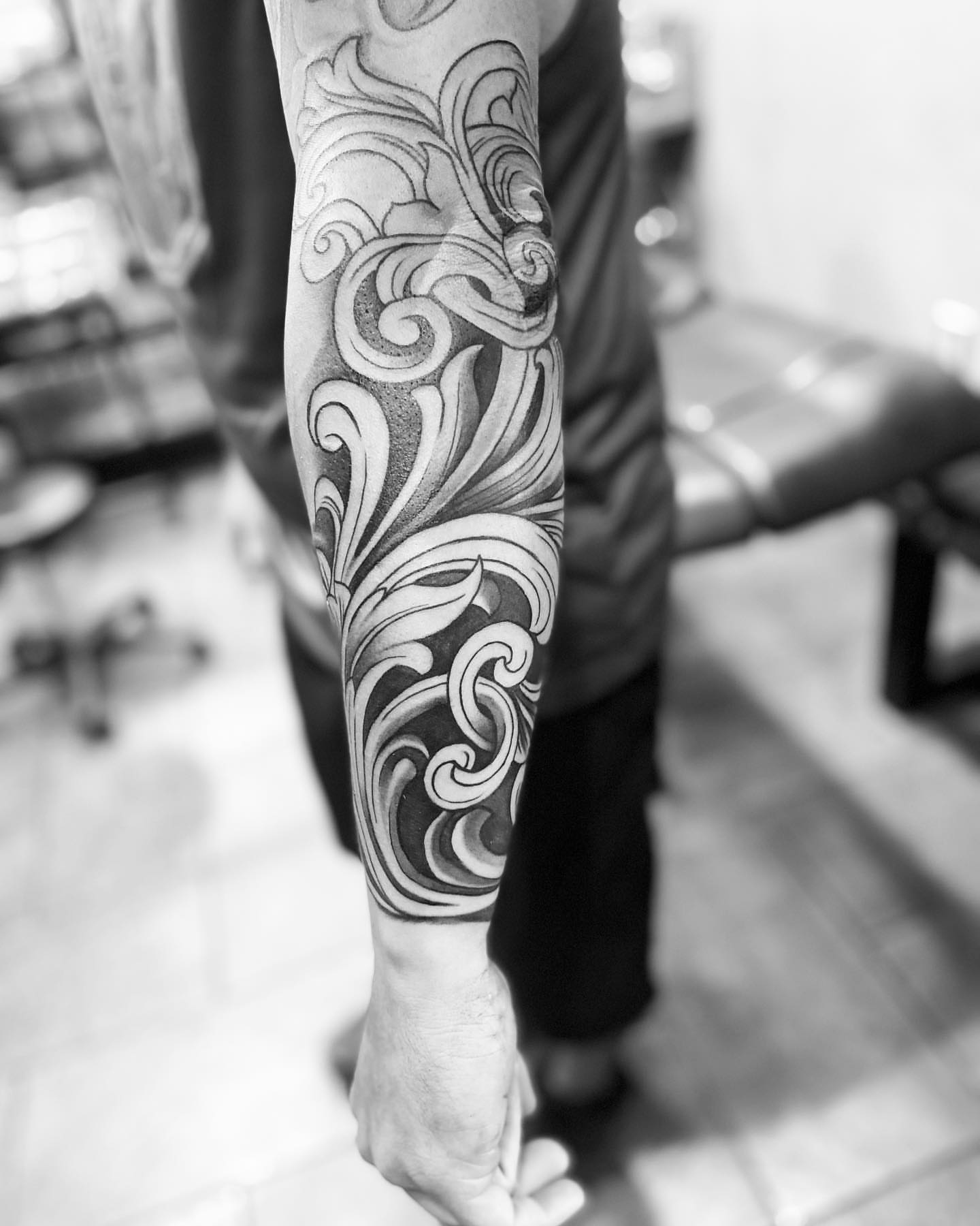 Swirls black and grey tattoo on the forearm by Brian Keith
