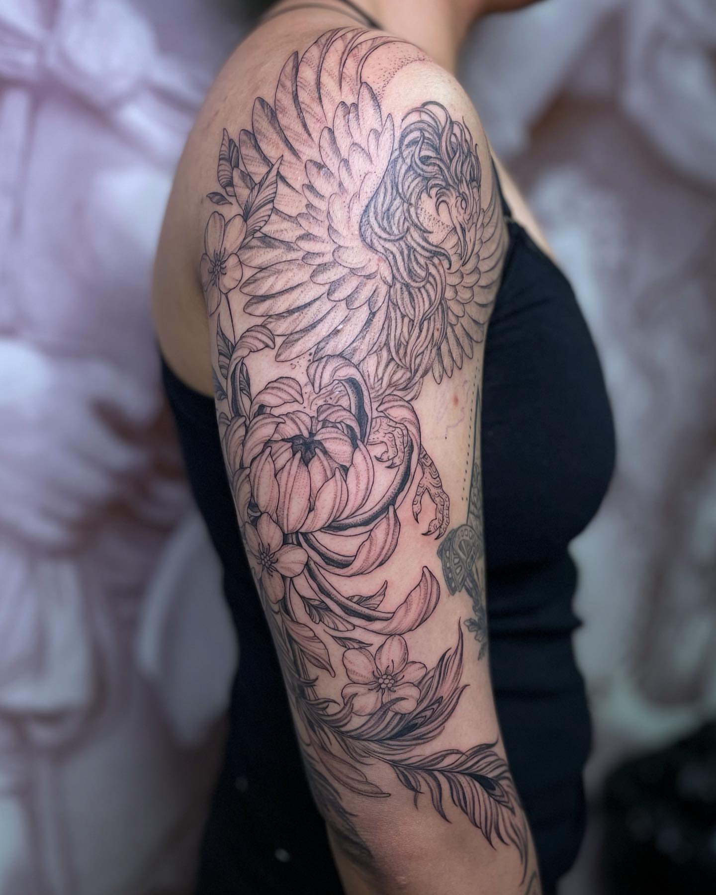 Floral phoenix realism tattoo on the forearm by @jettaturas, New City, New York