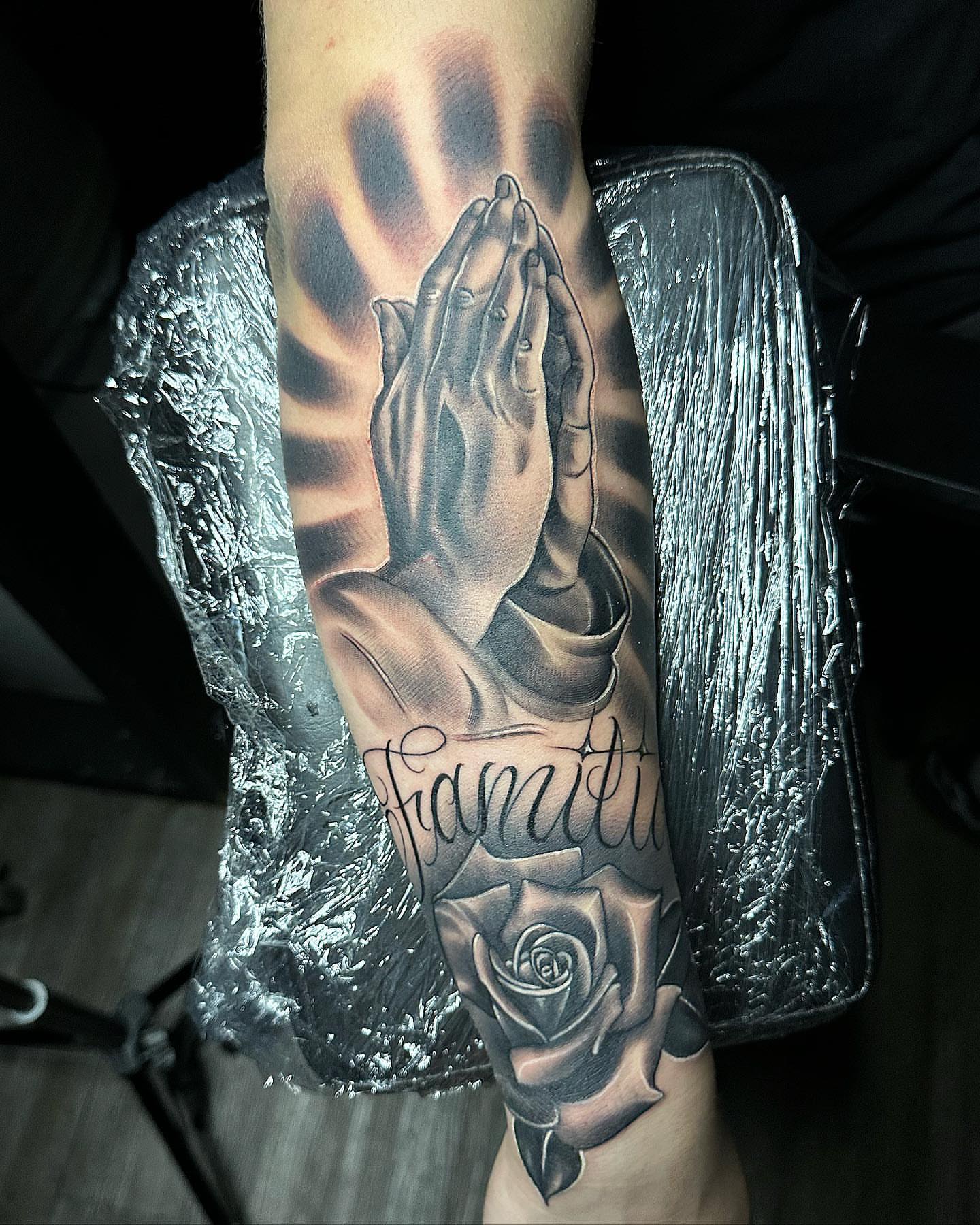 Praying hands realism tattoo on the forearm by TattsByShorty