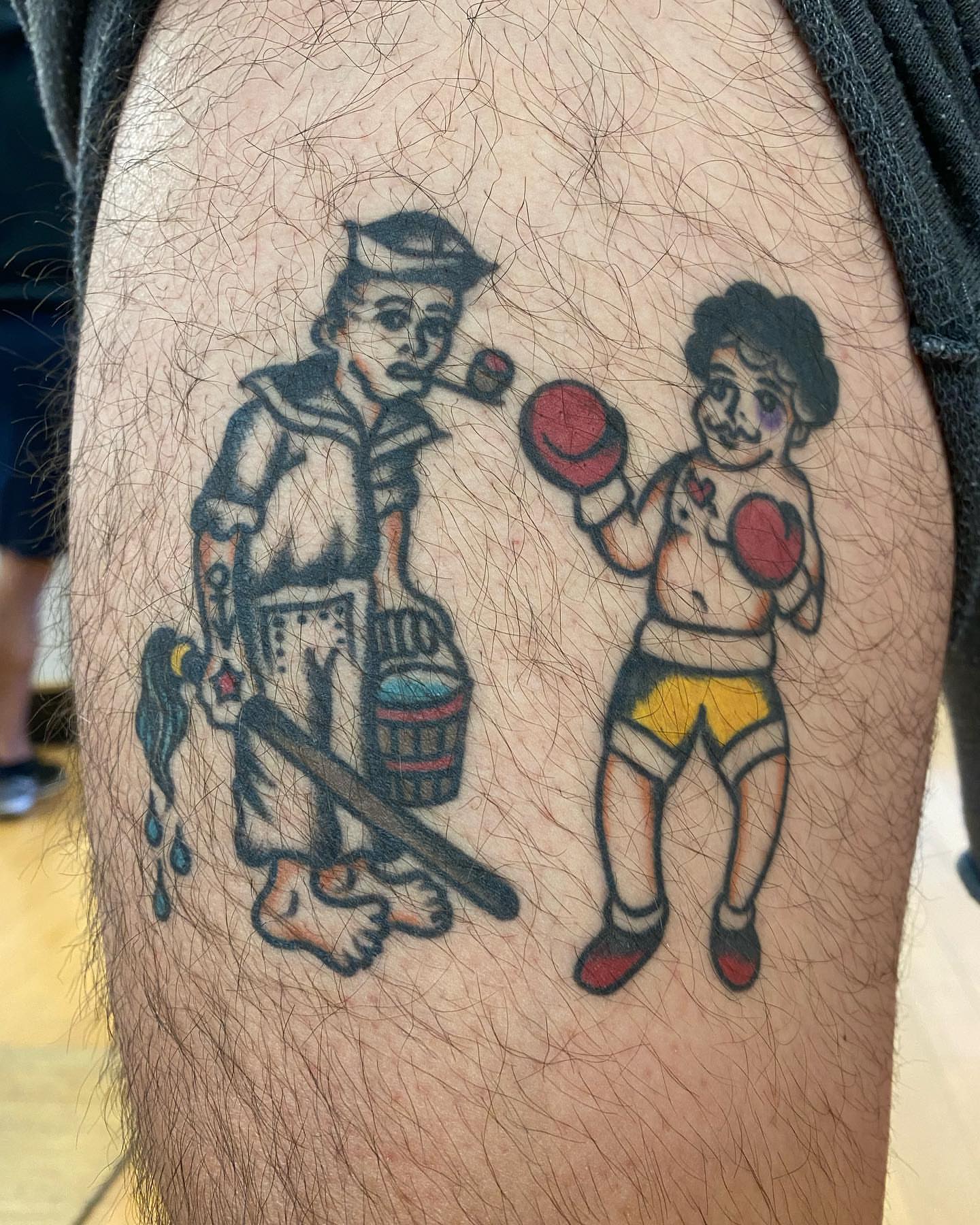 Cleaning man and boxer American traditional tattoo on the thigh by Alan Pham, San Jose, California