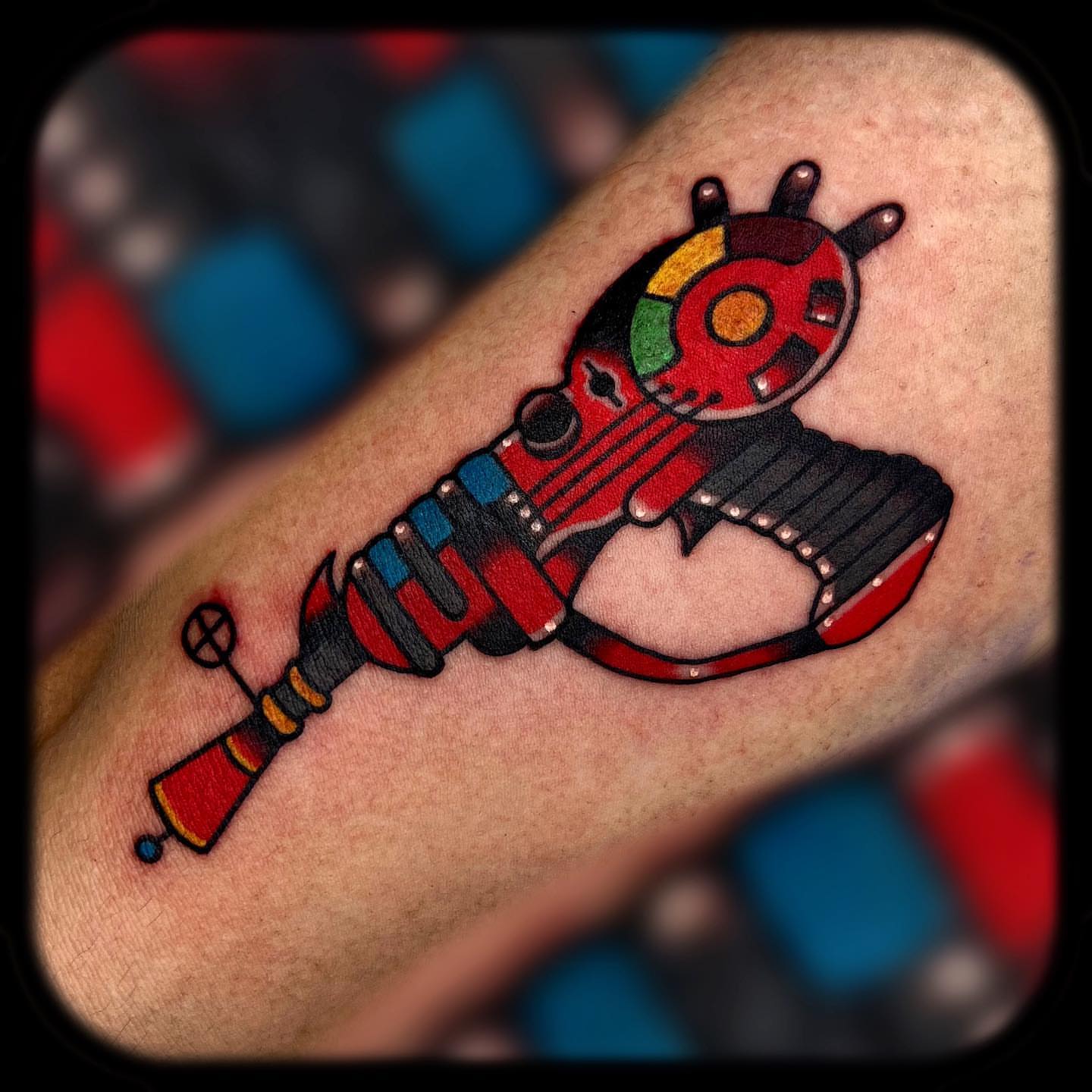 Robot gun American traditional tattoo on the forearm by Benjamin Ward